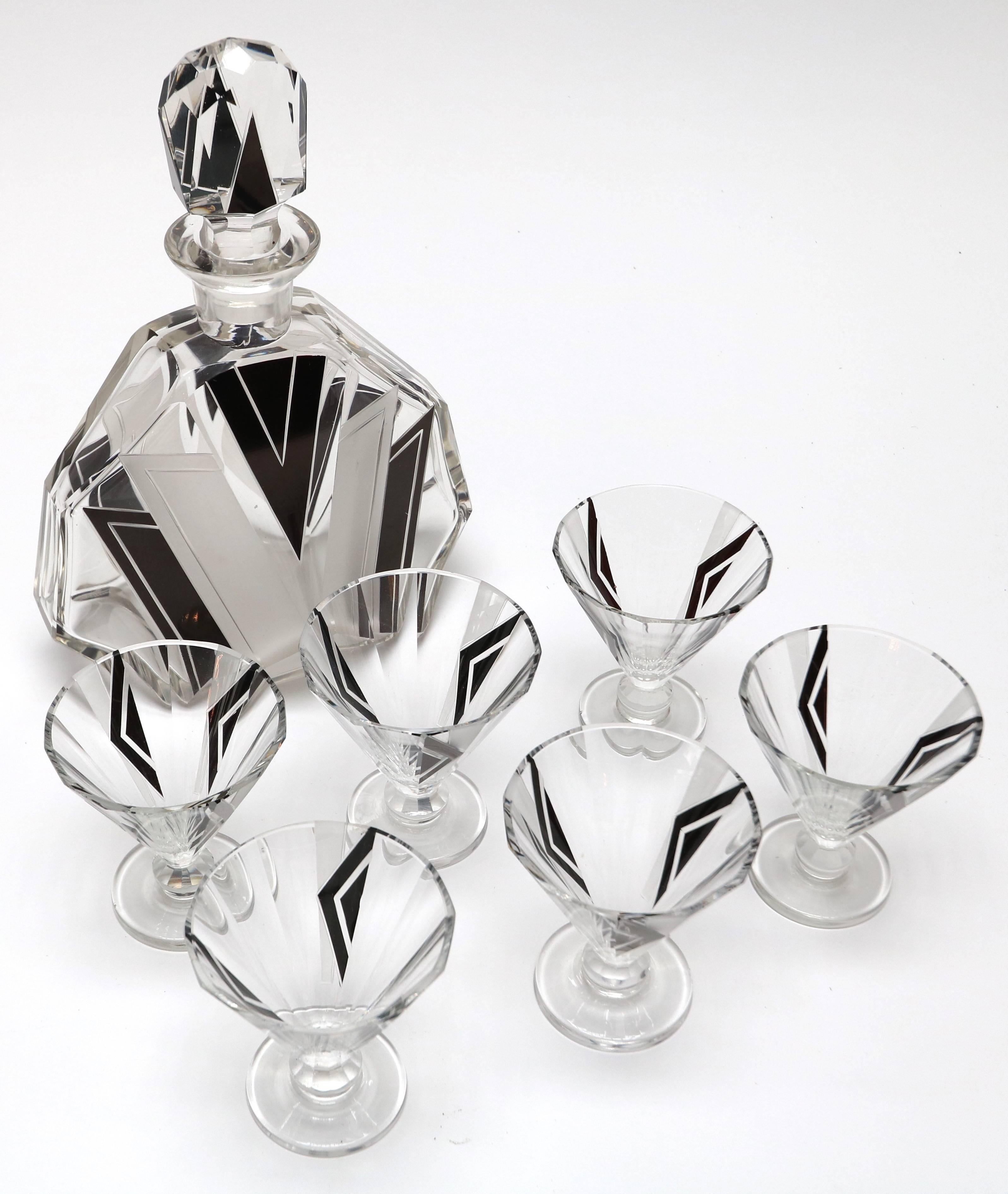 Black and silver Art Deco decanter set from the 1930s with six glasses.