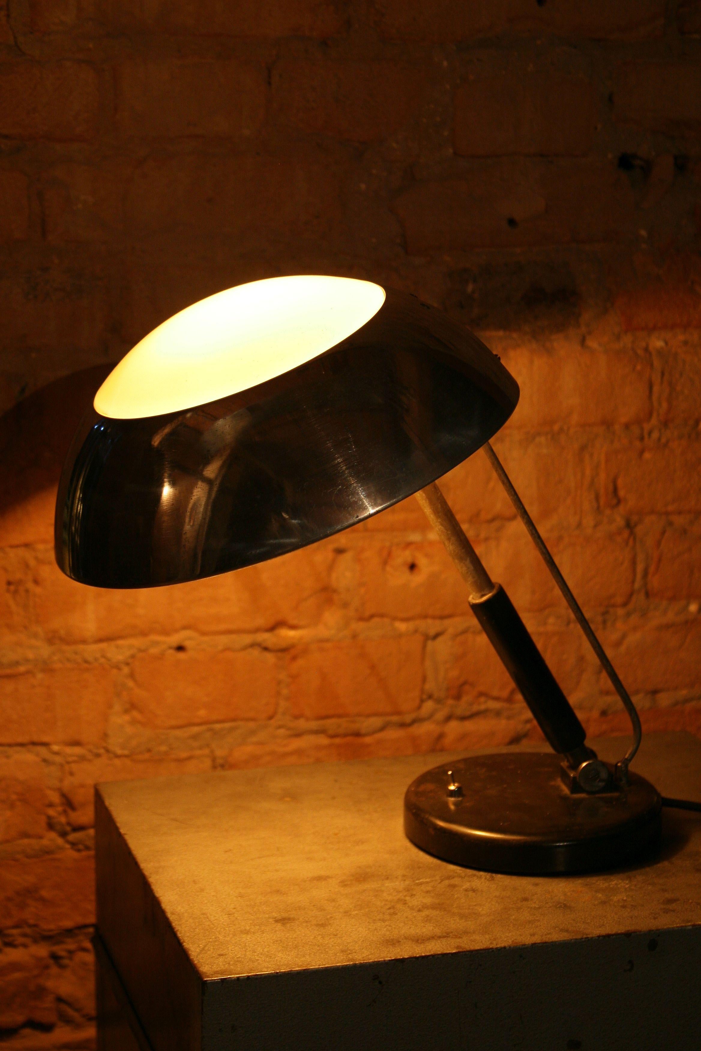 An original German desk lamp designed by Karl Trabert. It is one of the most interesting lighting products of the European Art Deco style.
Date of production: 1930.
Construction:
The base is made of profiled steel sheet with an internal cast-iron
