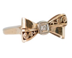 1930s Art Deco Diamond and Gold Ribbon Bow Ring in 14 Karat Yellow Gold