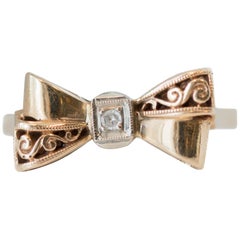 1930s Art Deco Diamond and Gold Ribbon Bow Ring in 14 Karat Yellow Gold