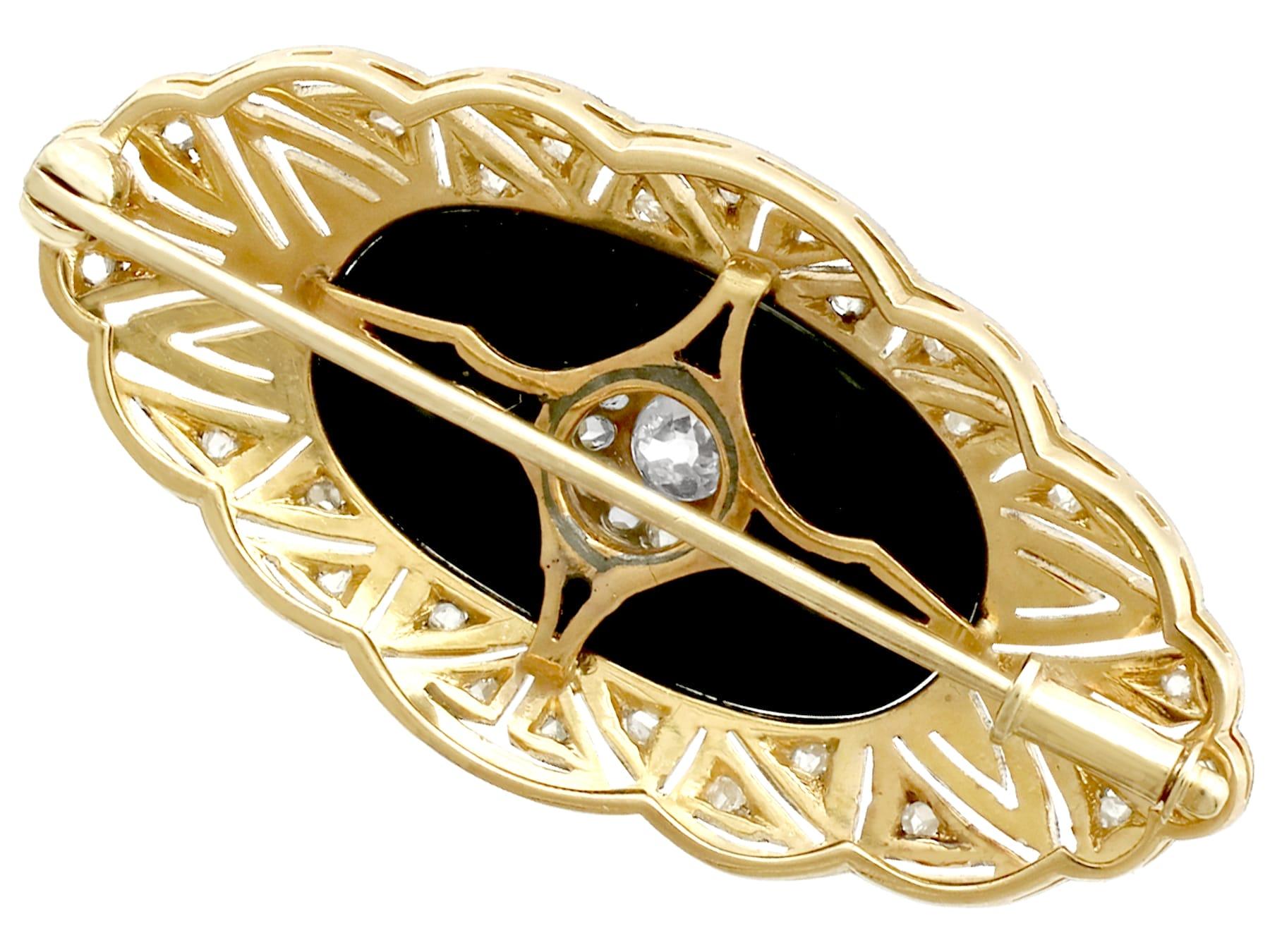 Round Cut 1930s Art Deco Diamond Black Onyx Gold Brooch For Sale