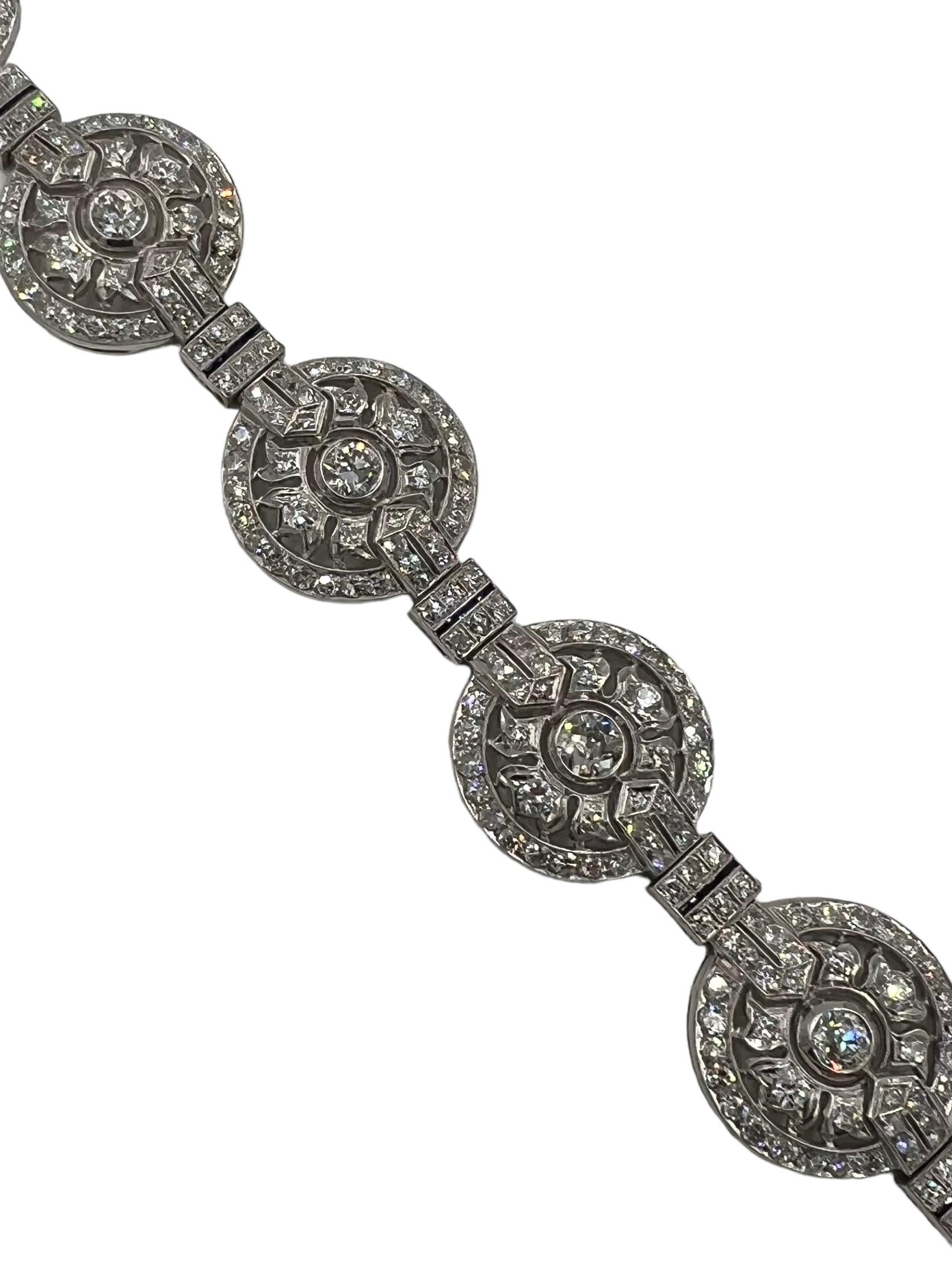 Art Deco diamond platinum circular bracelet, circa 1930s.

 The Art Deco Diamond Platinum Circular Bracelet is a stunning piece of jewelry that embodies the elegance and sophistication of the Art Deco era. Crafted with precision and attention to