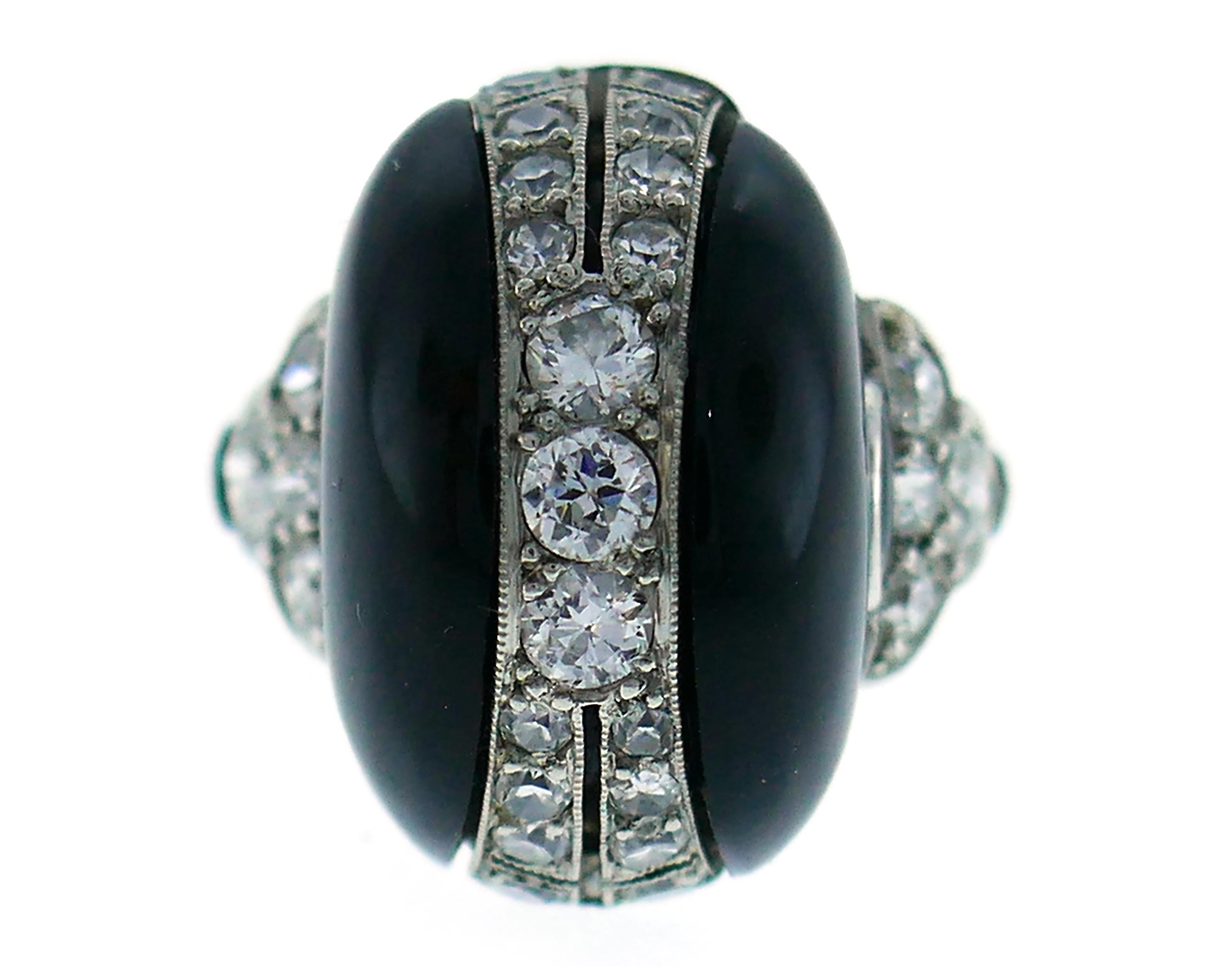 Elegant and dramatic Art Deco ring created in the 1930s.  
Made of platinum, black onyx and set with Old European cut diamonds (total weight approximately 0.84 carat).
The ring is size 5.25 and can be sized.
The top of the ring measures 3/4 x 7/16 x