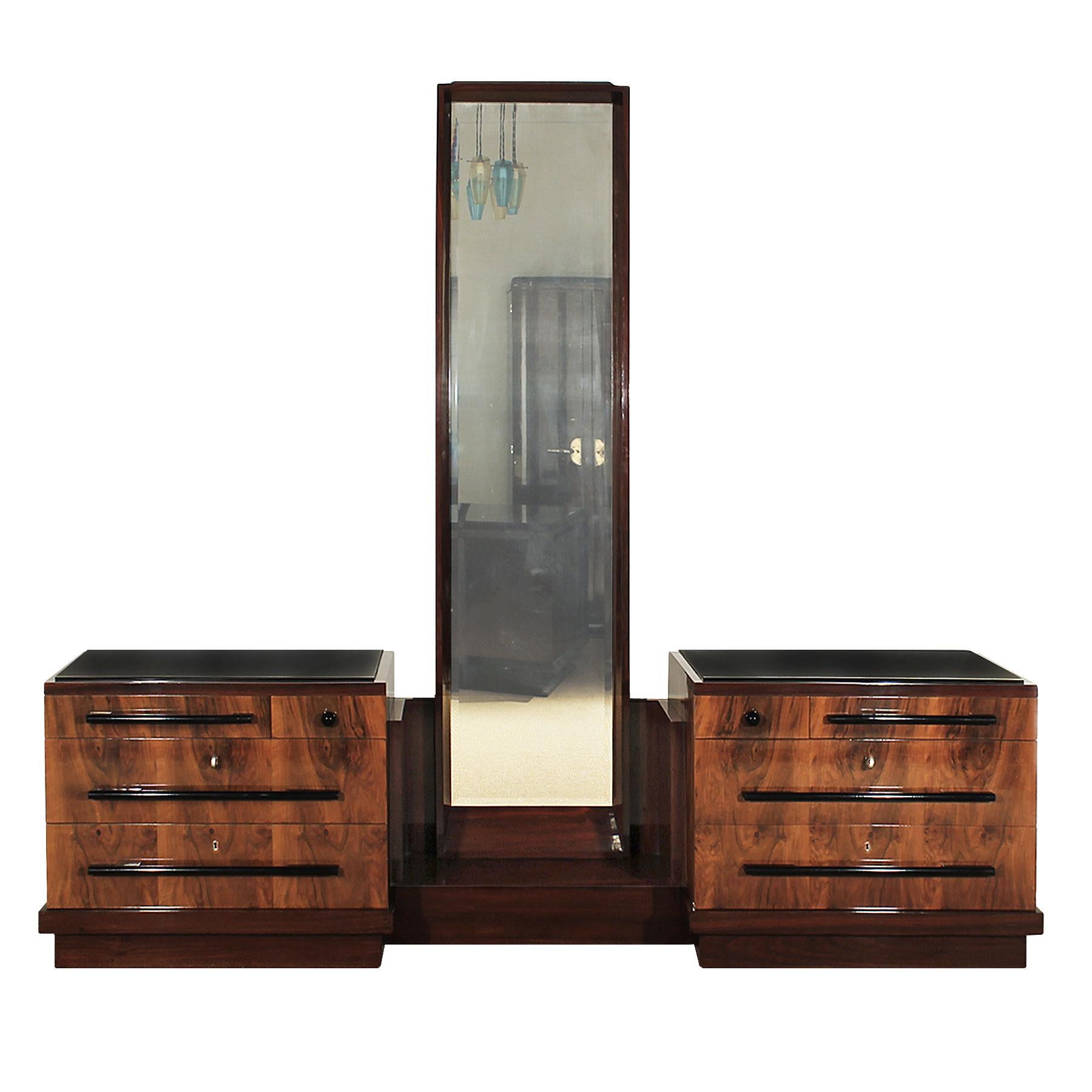 Art Deco double chest of drawers with central original mirror, walnut and mahogany veneered, eight drawers, black opaline on top.
Chests height: 68 cm.
Italy, 1930.