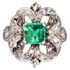 1930s Art Deco Emerald Diamond 18 Karat White Gold Platinum Ring