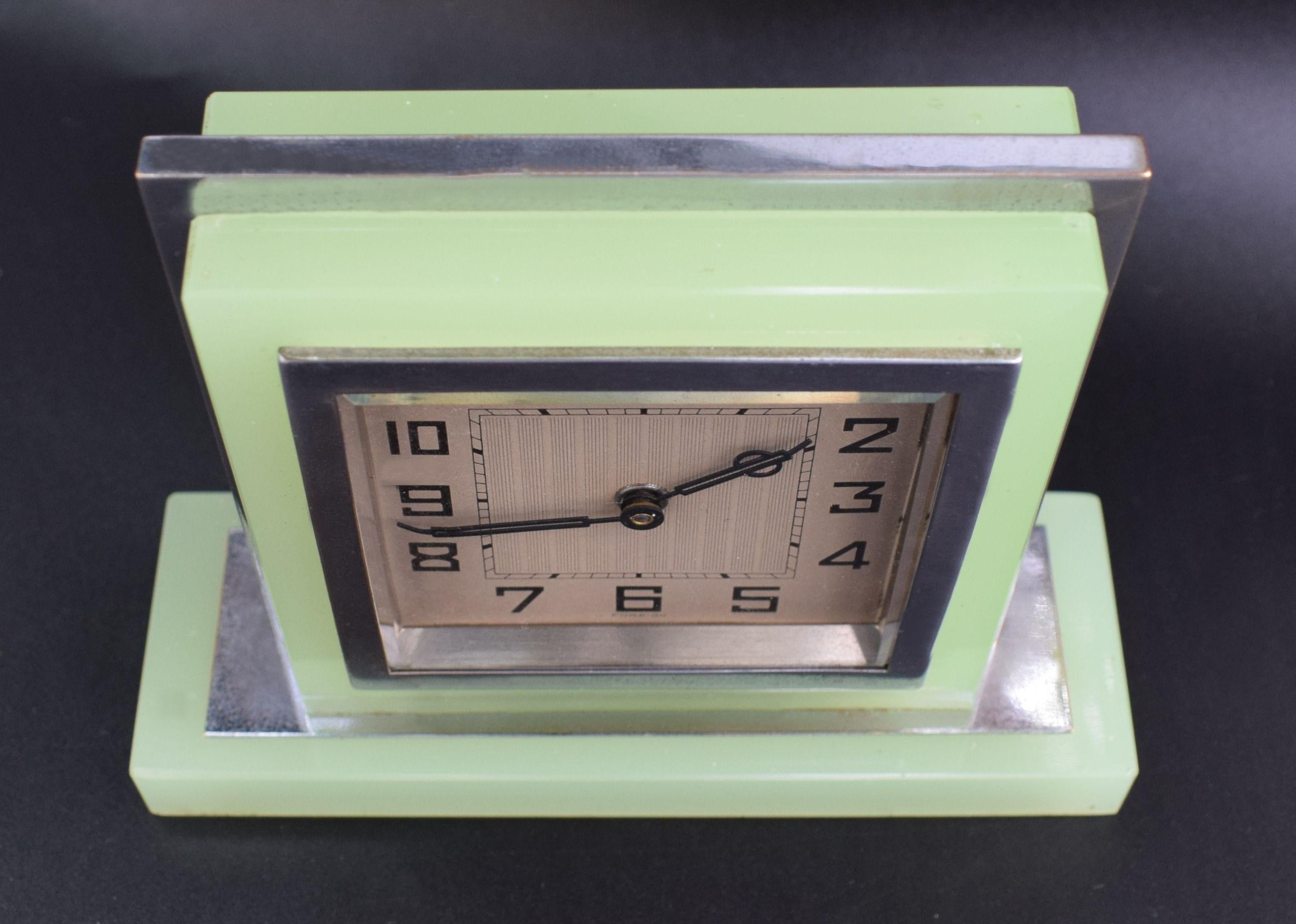 Original 1930s Art Deco opaque green glass clock with chrome accents. 30 hour clock recently serviced so is in good working order and keeps good time. 90 odd years old this clock will live another life time. No damage to report everything is in very