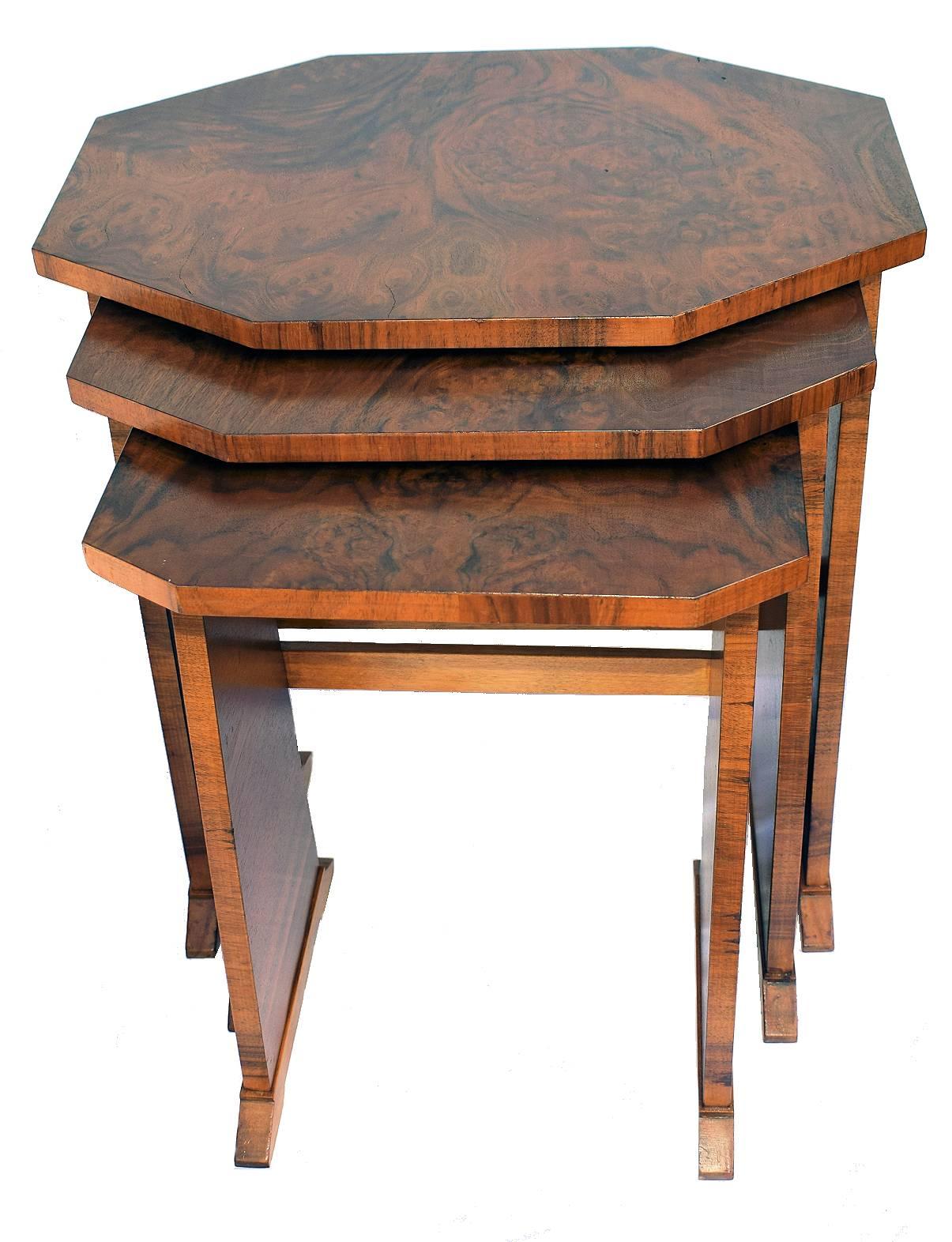 A stylish 1930s Art Deco nest of tables. One large with two under tier inserts with the most exquisite warm walnut veneers. A rare classic set to enhance your home interior. In excellent condition. having been recently and professionally restored.