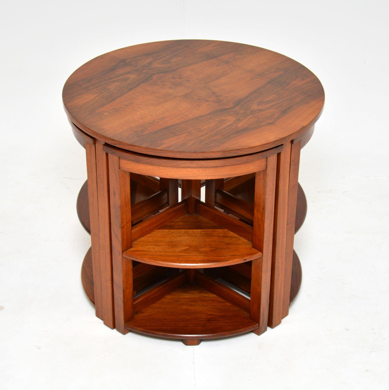 A stylish and extremely well made original Art Deco period nesting coffee table in walnut. This was made in England, it dates from the 1930’s.

The quality is amazing, this has a gorgeous design and is very practical. The four smaller pie shaped