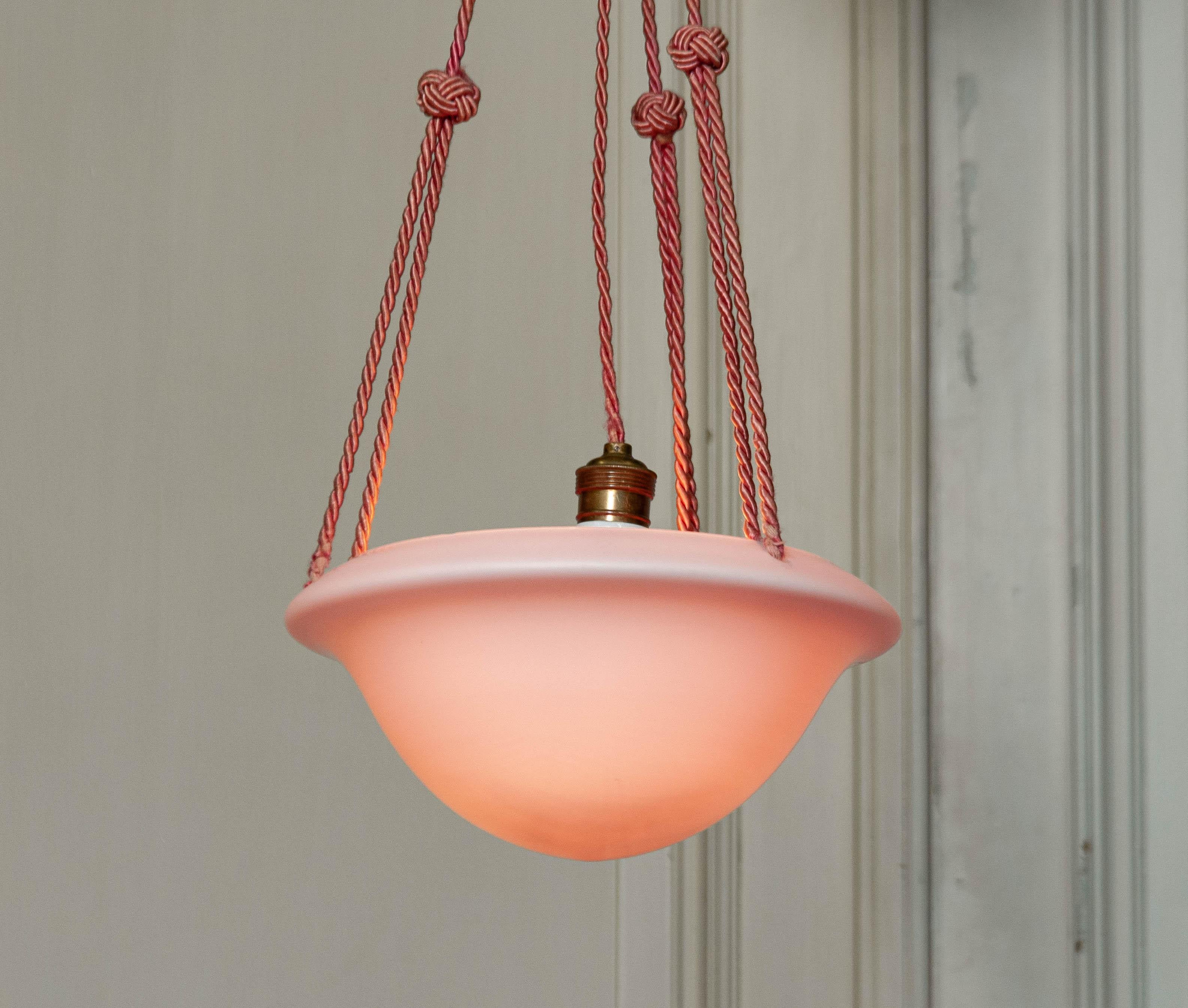 Beautiful 1930s French Art Deco pink frosted glass pendant.
This lamp has its original wiring , canopy , original cord, brass and porcelain screw fitting.
The bowl has some small chips on the top inside, if not visible, see photo.