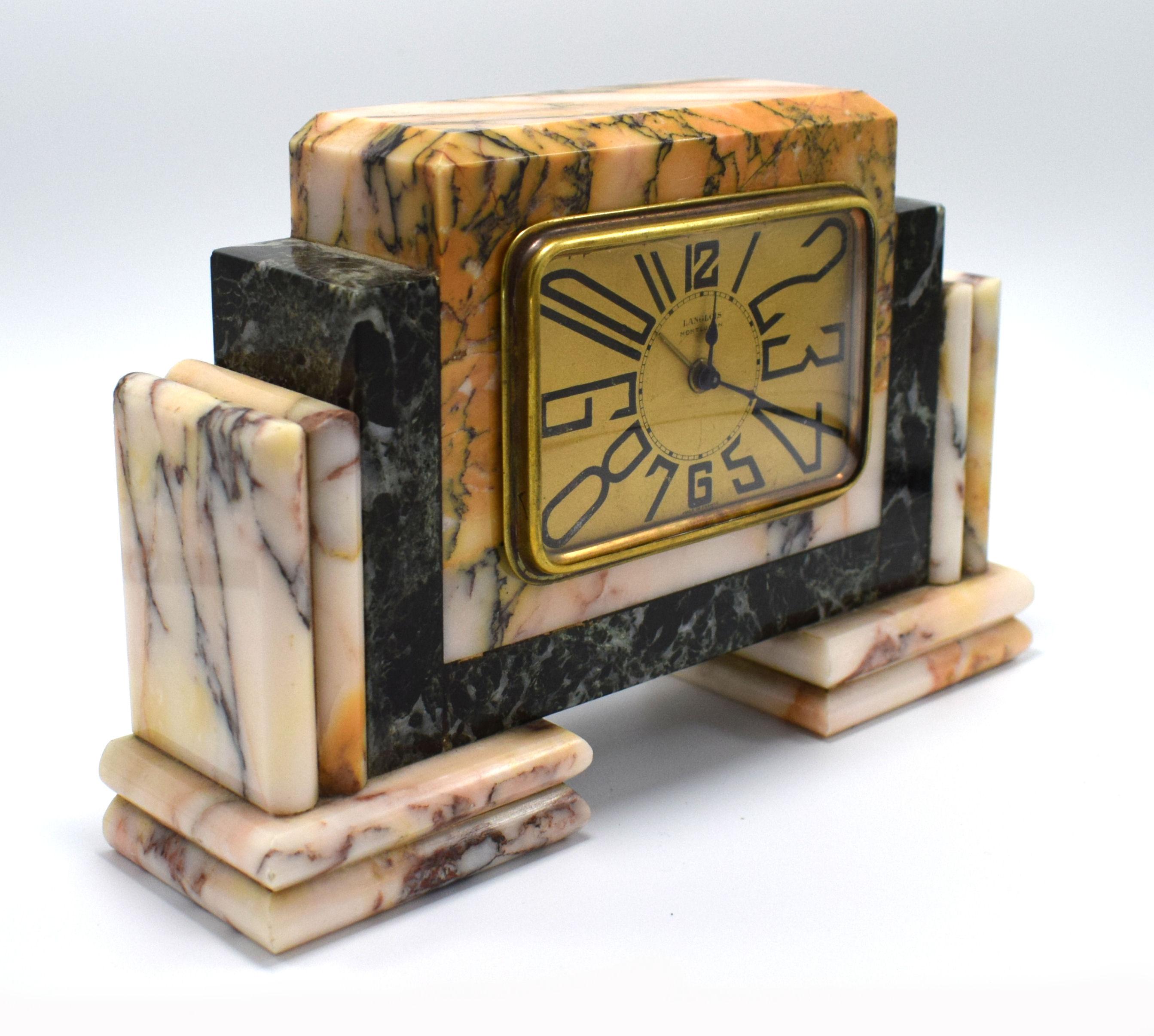 Very striking 1930s Art Deco French clock by Langlois. The case is solid multicoloured marble, the bezel and face are in gold tone metal. Very iconic Art Deco stretched numerals. This clock is a really cute size and ideal as a bedroom clock or side