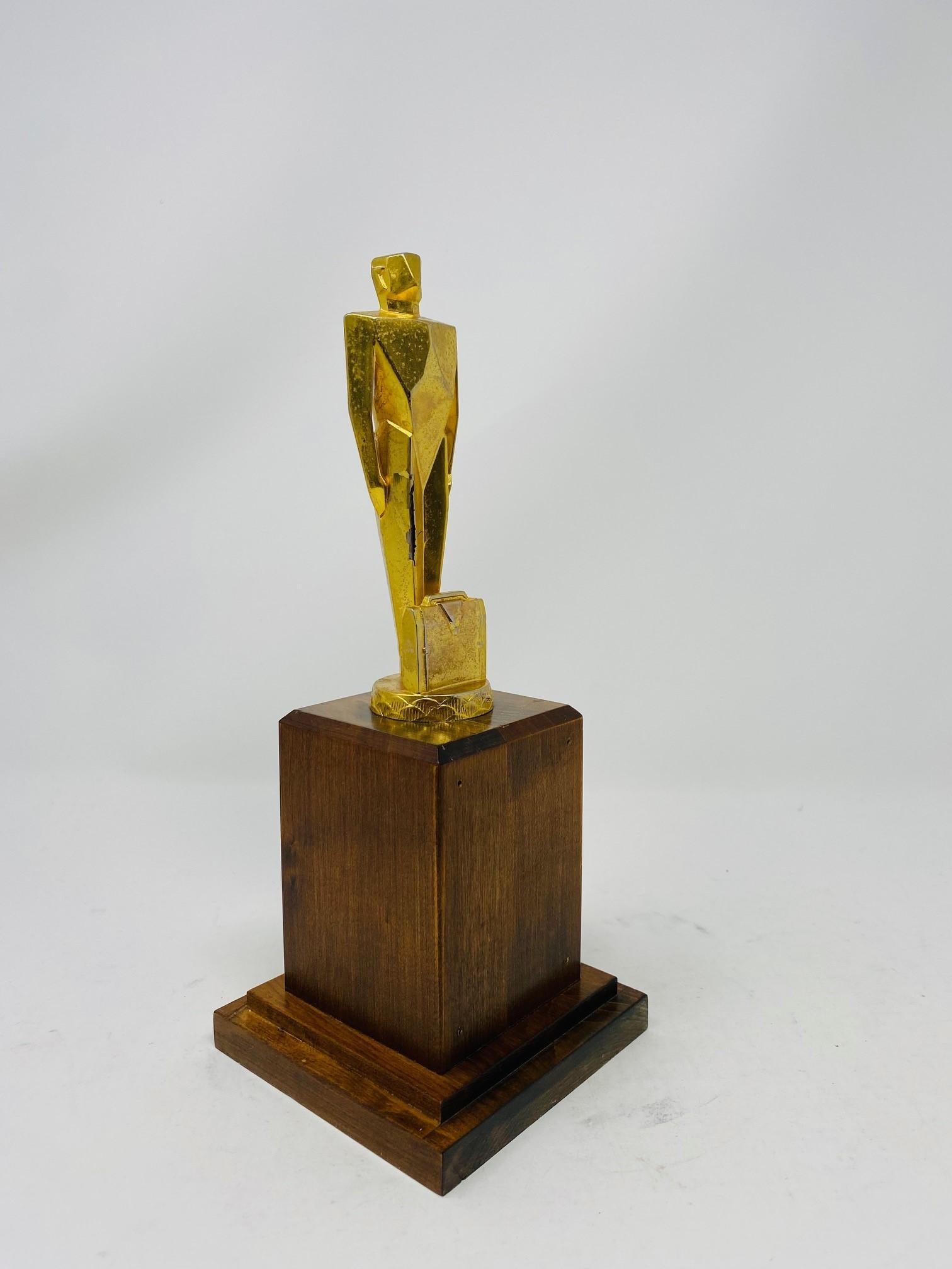 Beautiful and unique art deco trophy sculpture.  These trophy sculptures were made from the 30's to the early 60's and were given as recognition for sales executives.  These are rare and this one belongs to the original cast creations.  The figure