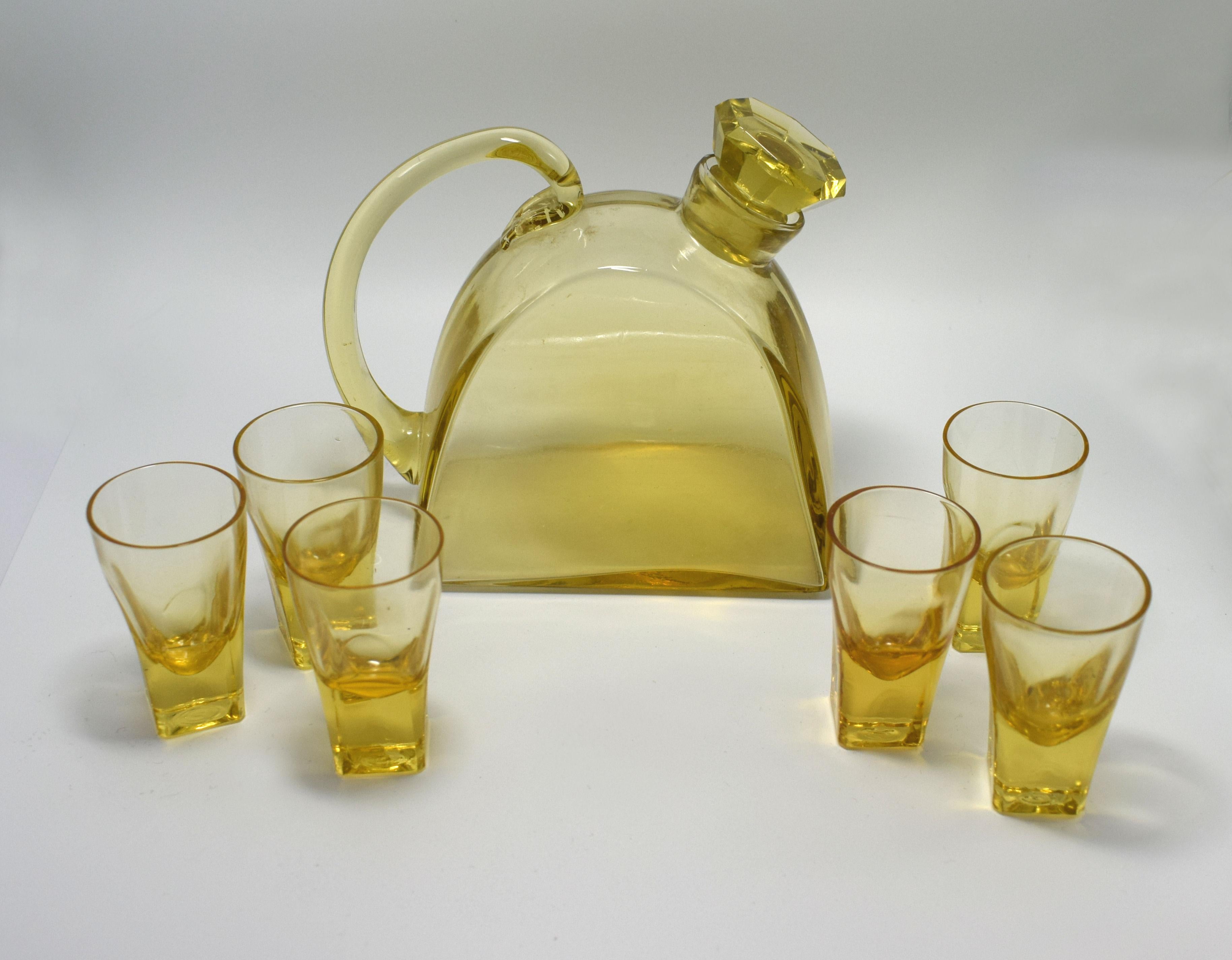 1930s Art Deco decanter set with tray. The tray this is a fabulous and original 1930s Art Deco drinks tray originating from France. Full gold tone metal stepped surround with wooden handles either side. Ideal size for use or display. These trays
