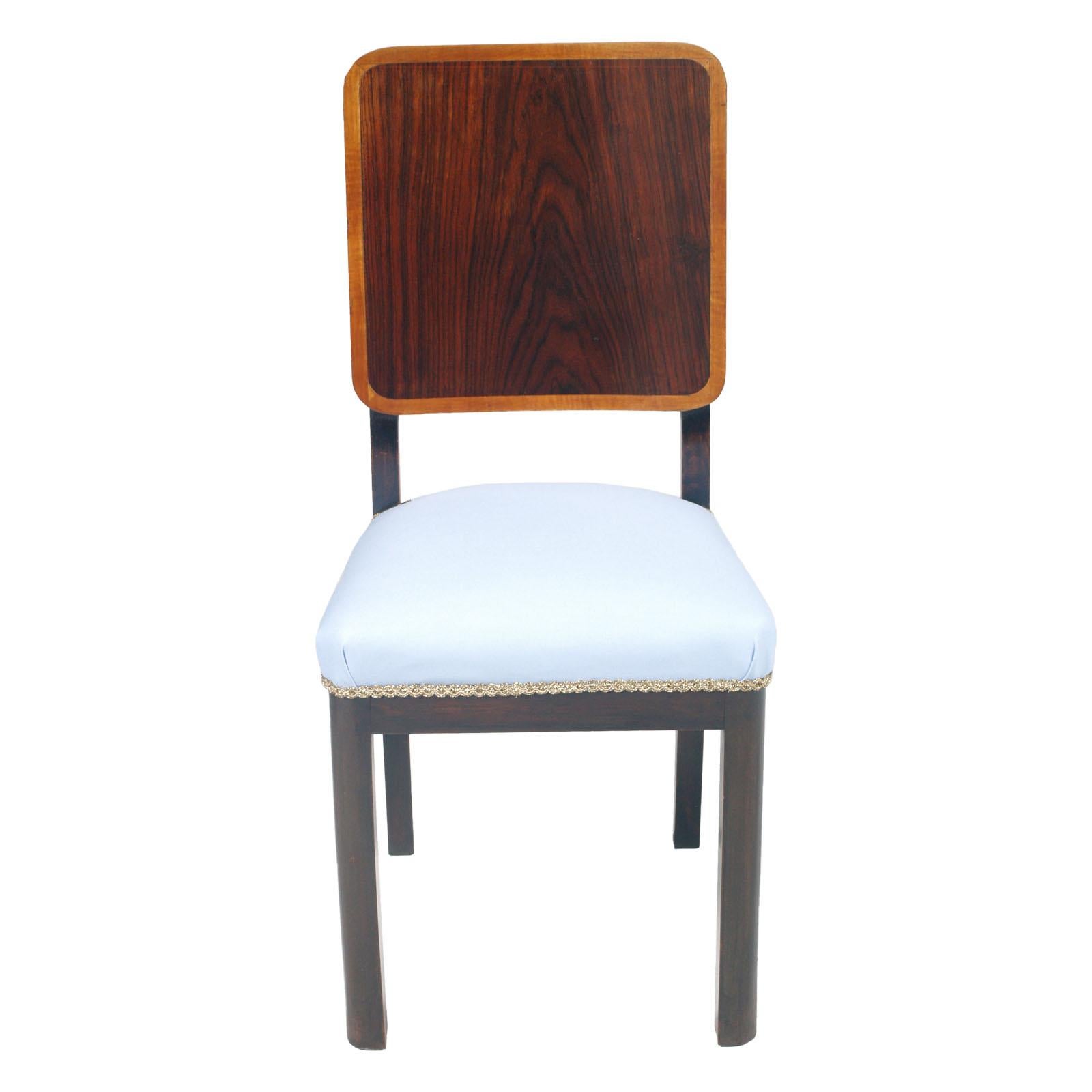 1930s Art Deco Italian robust side chair in ebonized mahogany and mahogany veneered the back, new upholstered with light blue cotton fabric. Original spring seat; upholstered and wax polished
Belonging to a piece of furniture from the Varedo