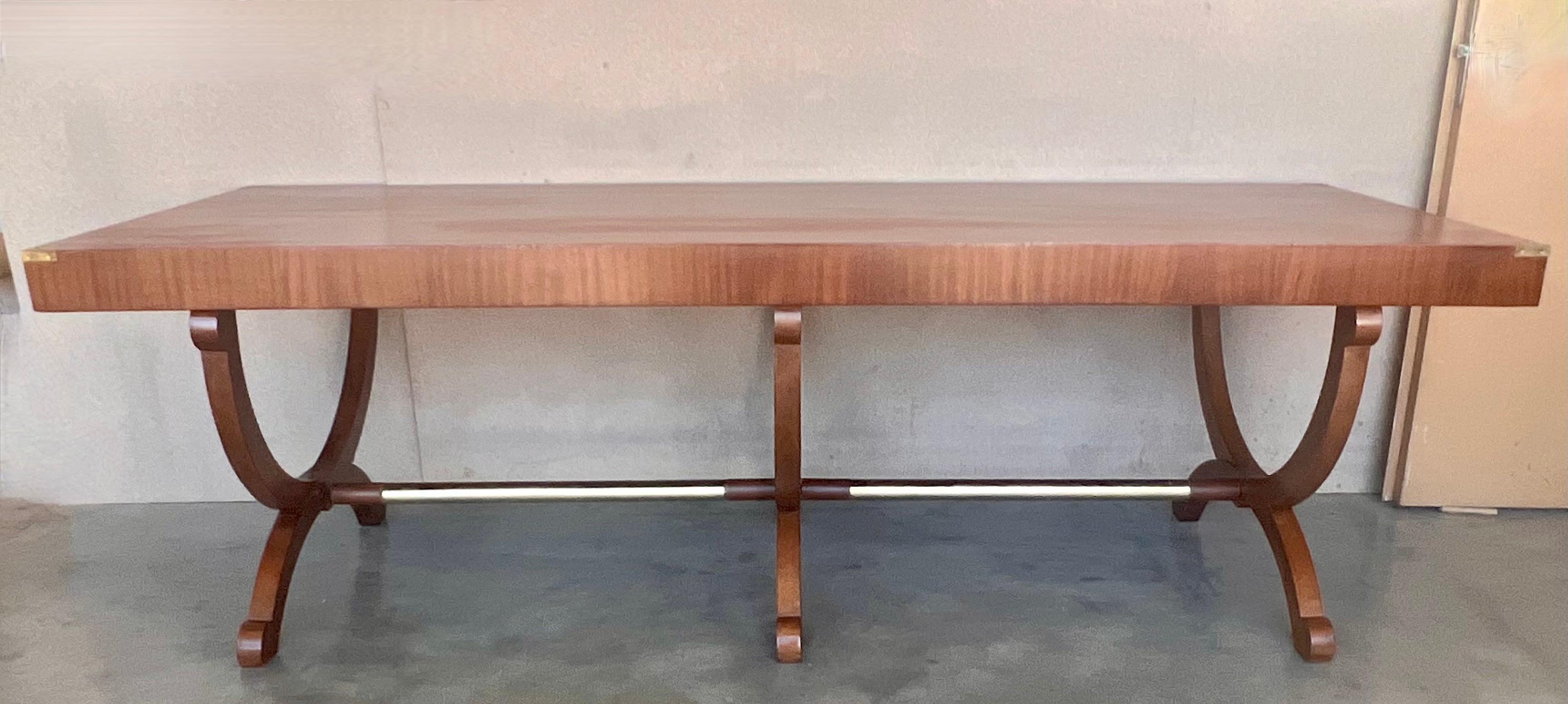 This table was manufactured in France circa 1930 and is a versatile table that can be used as an occasional dining table, hall table or desk  The top is supported by lyre shaped end supports joined by a stretcher.  
The finished is really beautiful,