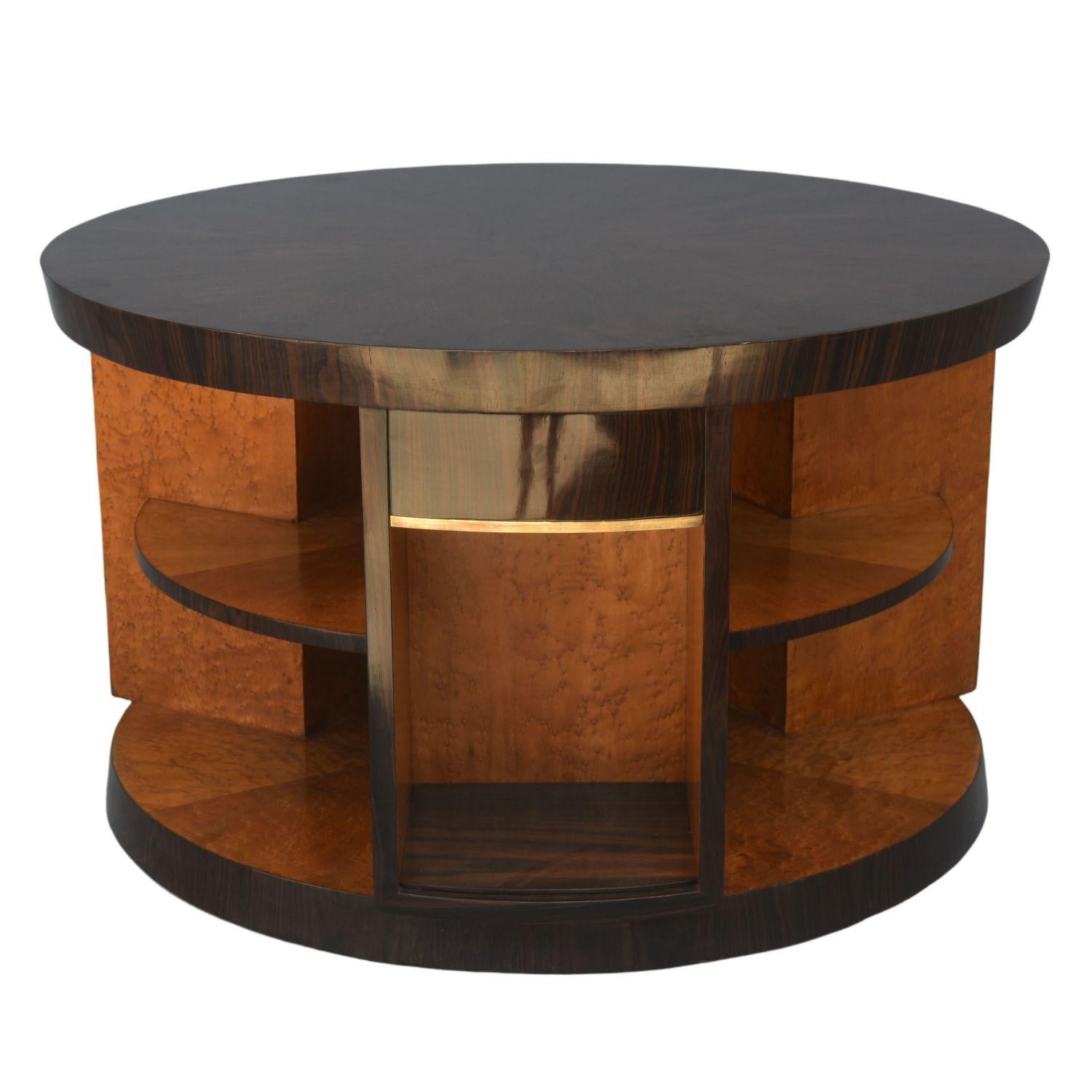 Large library pedestal table in speckled maple Macassar ebony veneer and brass in perfect condition. 3 compartments and 3 drawers mounted on oak. Top and base with an inverted bevel. Pedestal table attributable to Eugène Printz or Michel Duffet.