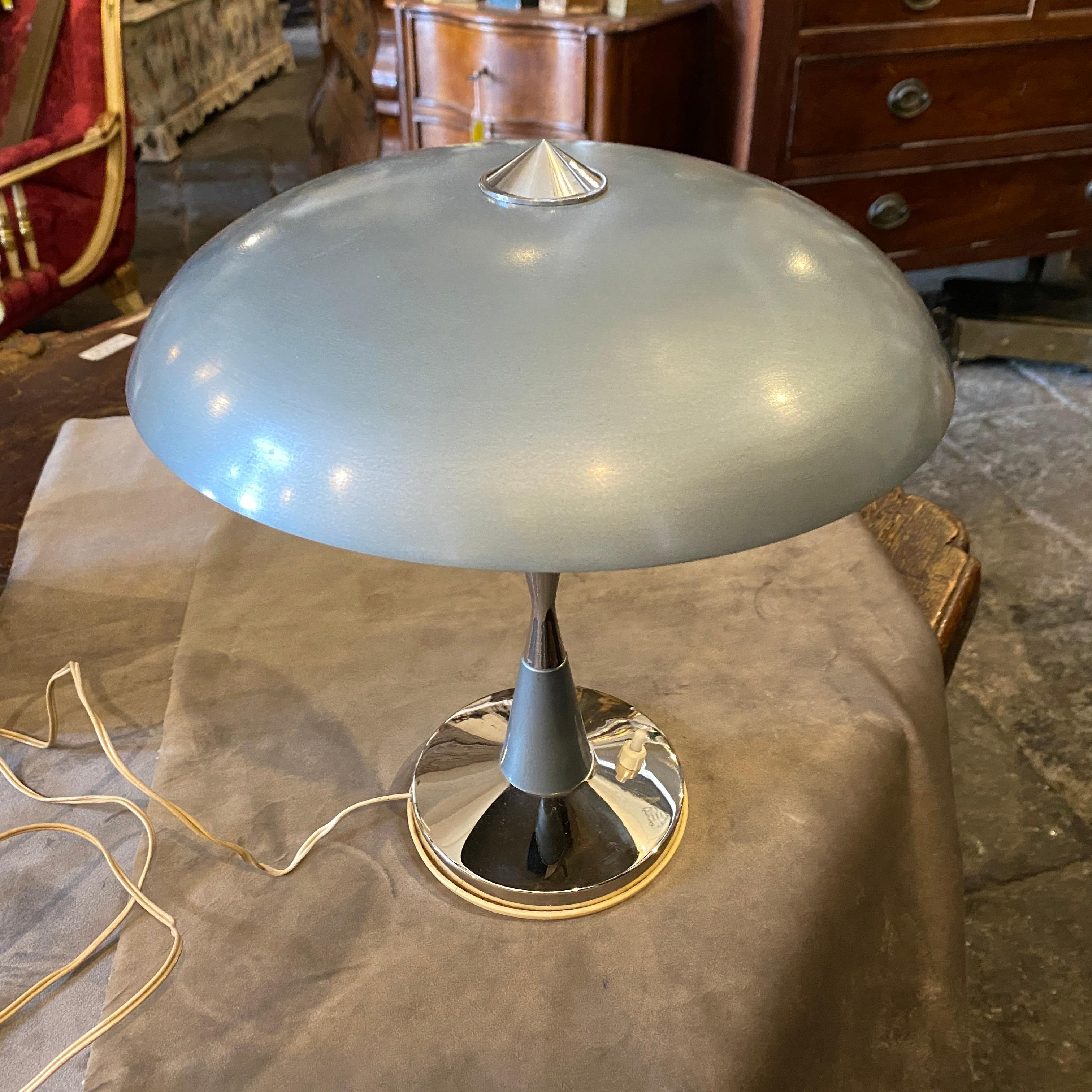 A stylish desk lamp made in Italy in the Thirties. It works 110-240 volts and needs two regular e14 bulbs. Metal and plastic of the base are in very good conditions.