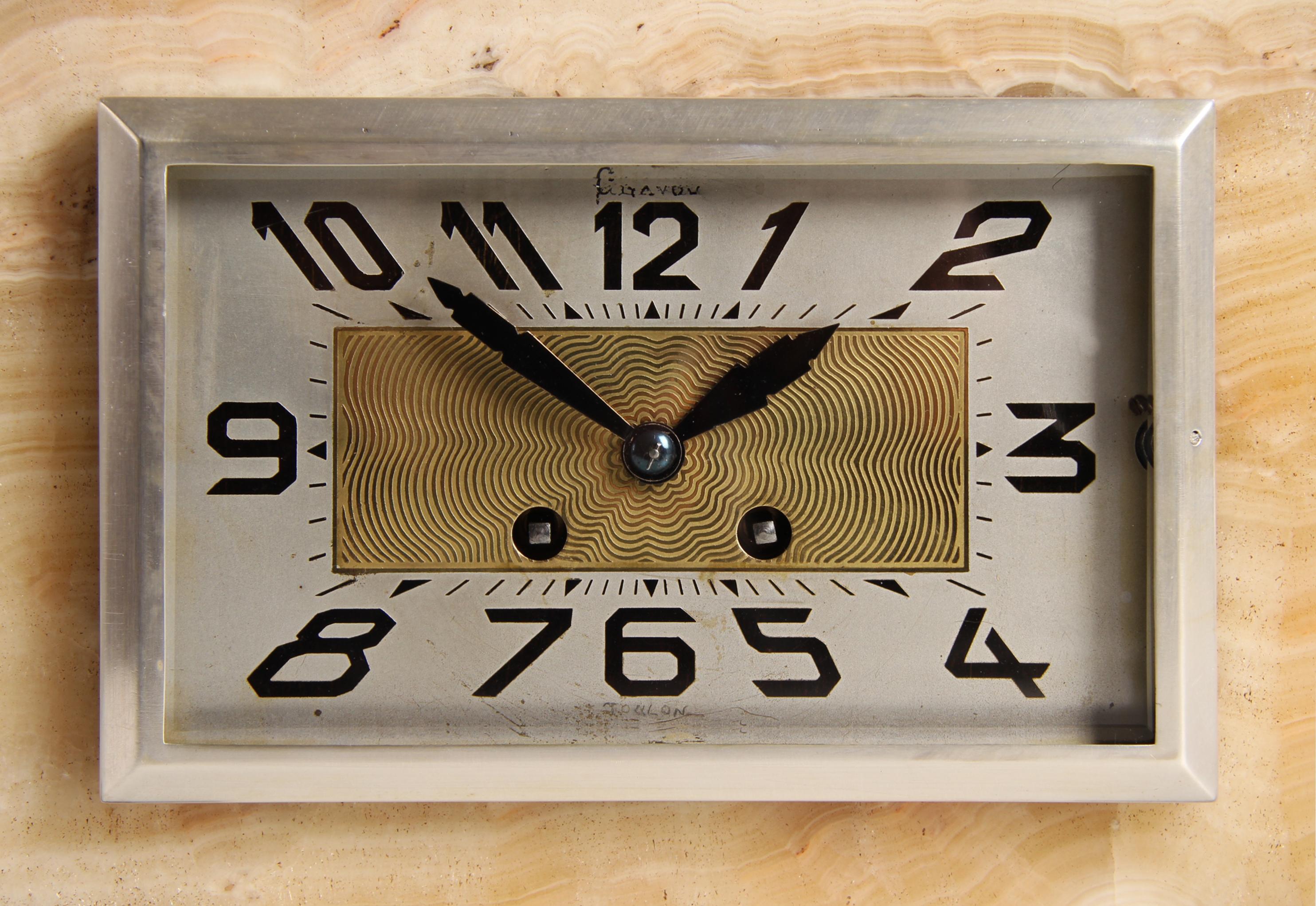 Art Deco Mantel Clock

France
Marble, bronze
1920s

Dimensions: H x W x D: 35 x 46 x 11 cm

Description:
Antique mantel clock in the typical Art Deco design.

The flat rectangular marble-clad case stands on small brass feet. To the left and right of