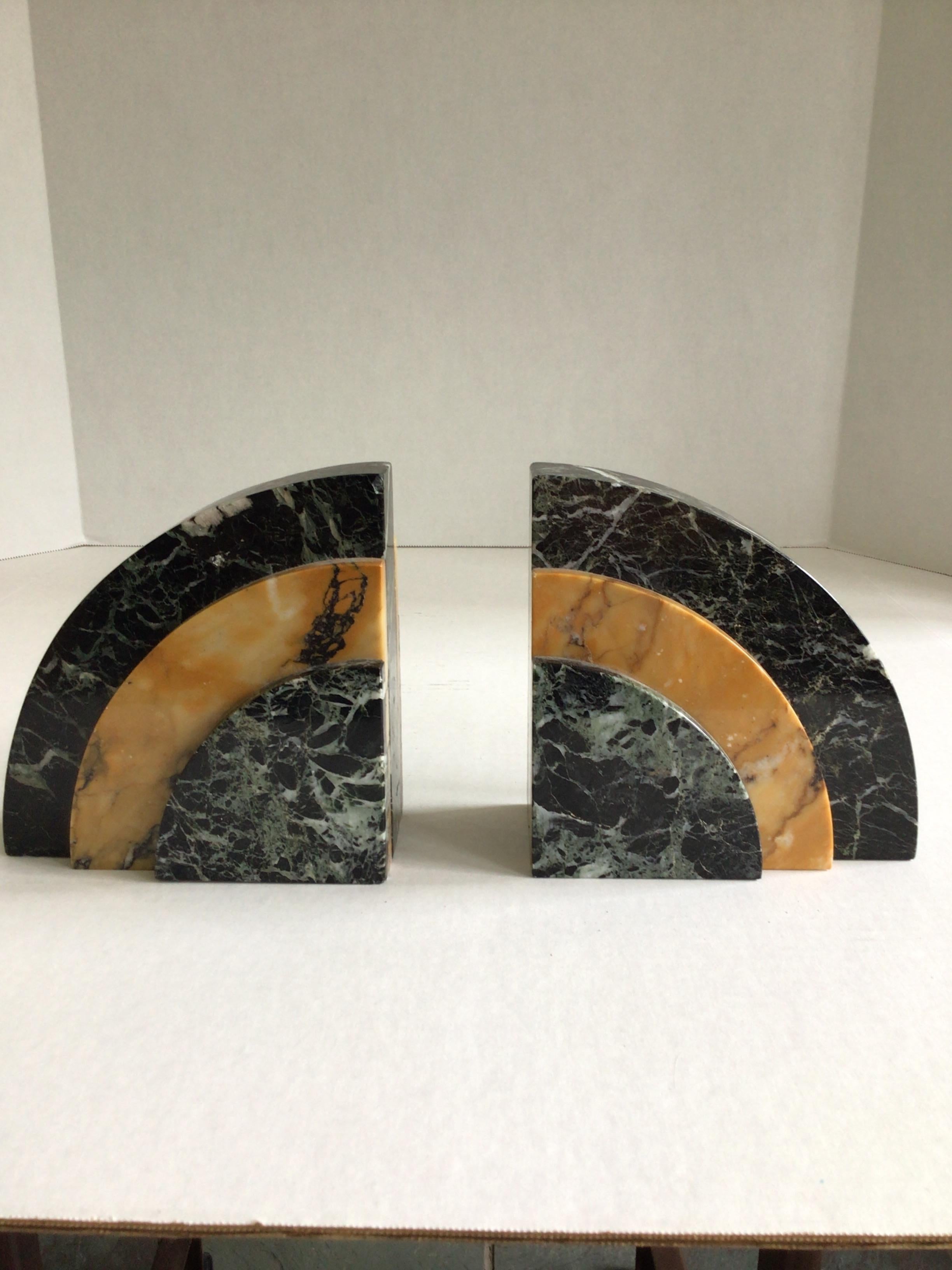 1930s Art Deco Marble Bookends 
Green marble with white veining
Gold marble with black veining
This pair of bookends would look great in an office or recording studio
Evokes old Hollywood or Radio City Music Hall 
Dimensions given are for one