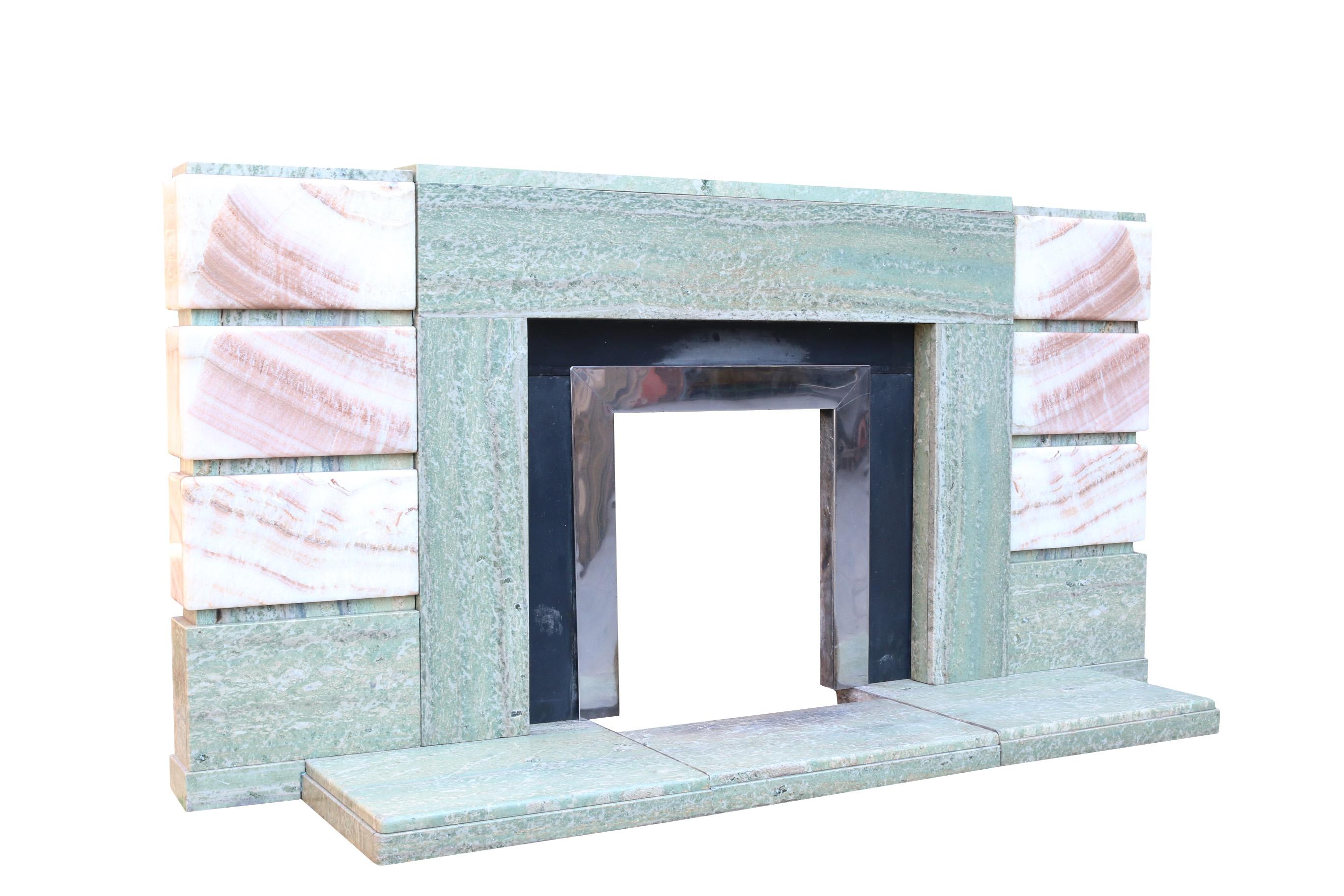 This Onyx and Connemara marble fire surround is in excellent original condition. It has black marble slips and a stainless steel insert.
Height 100.5 cm (including the hearth)
Width 198.5 cm (widest point)
Depth 12.5 cm (including the hearth 52