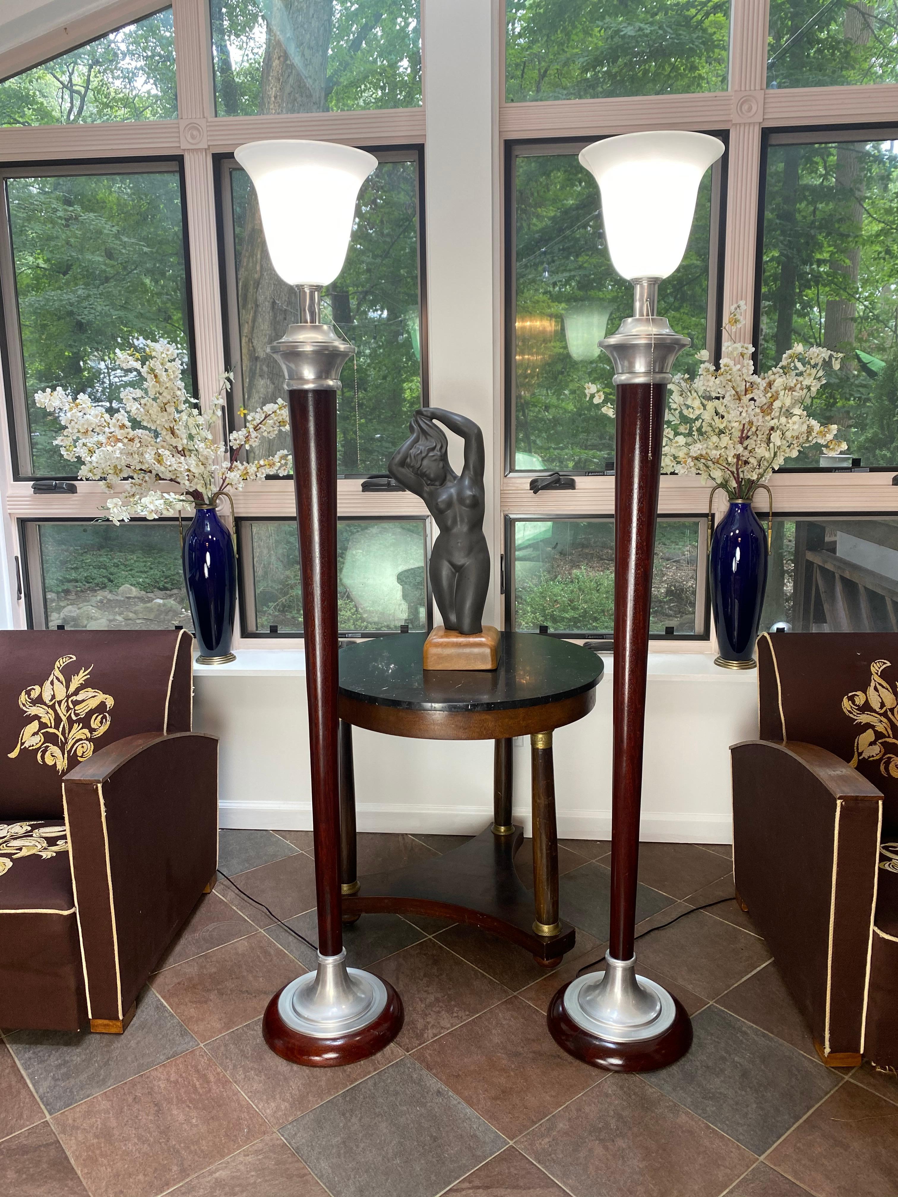 Pair of rare 1930s Art Deco Mazda floor lamps with original Mazda Lamps Factory stamp. Made in France. They feature an opaque (Opaline) glass shade with chrome detailing and restored mahogany wood. All in impeccable conditions.
Provenance: L’hôtel