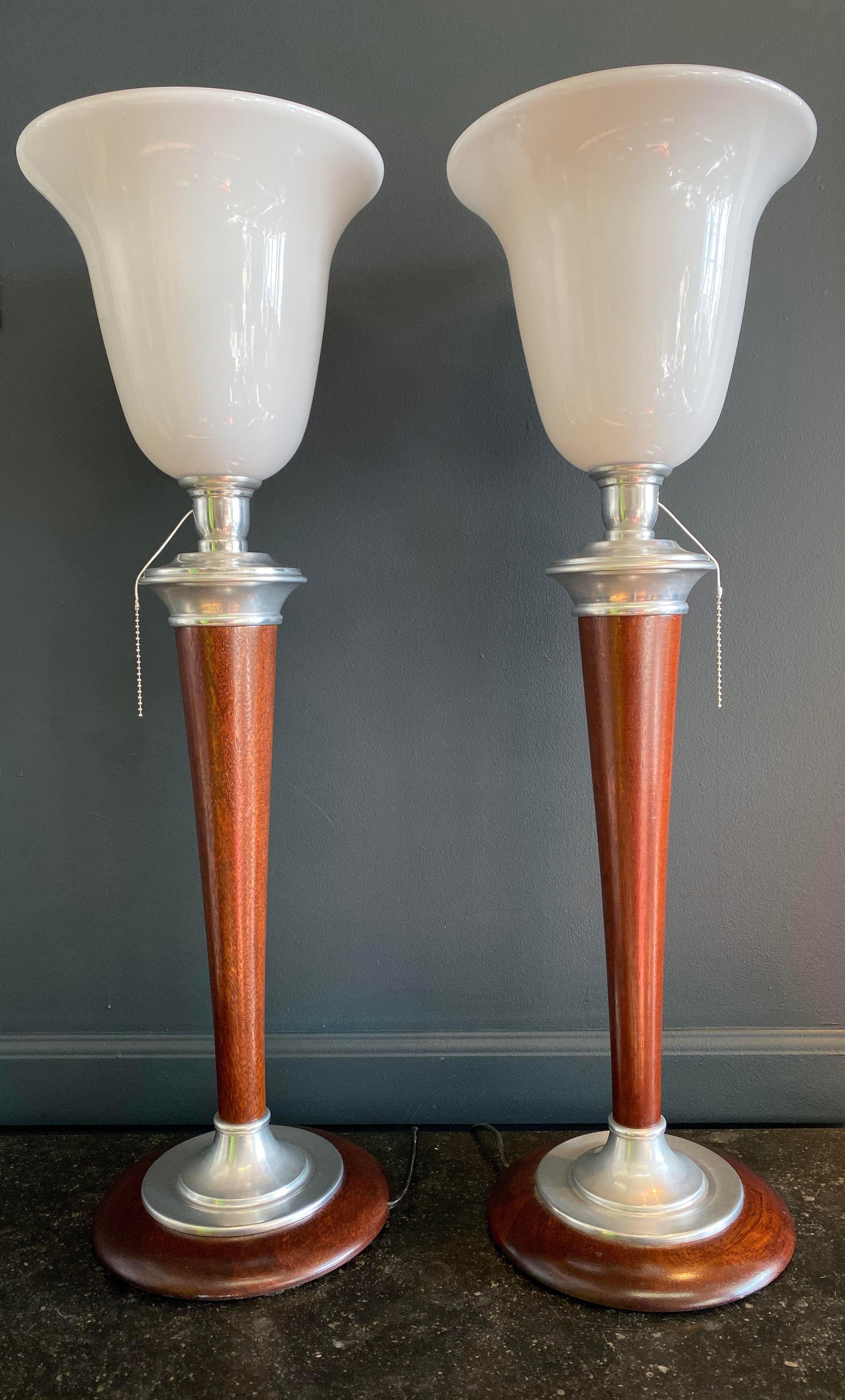 Pair of rare 1930s Art Deco Mazda lamps with original Mazda Lamps Factory stamp. Made in France. They feature an opaque (Opaline) glass shade with chrome detailing and restored mahogany wood.

Made in France. Authentic 1930. Restored and
