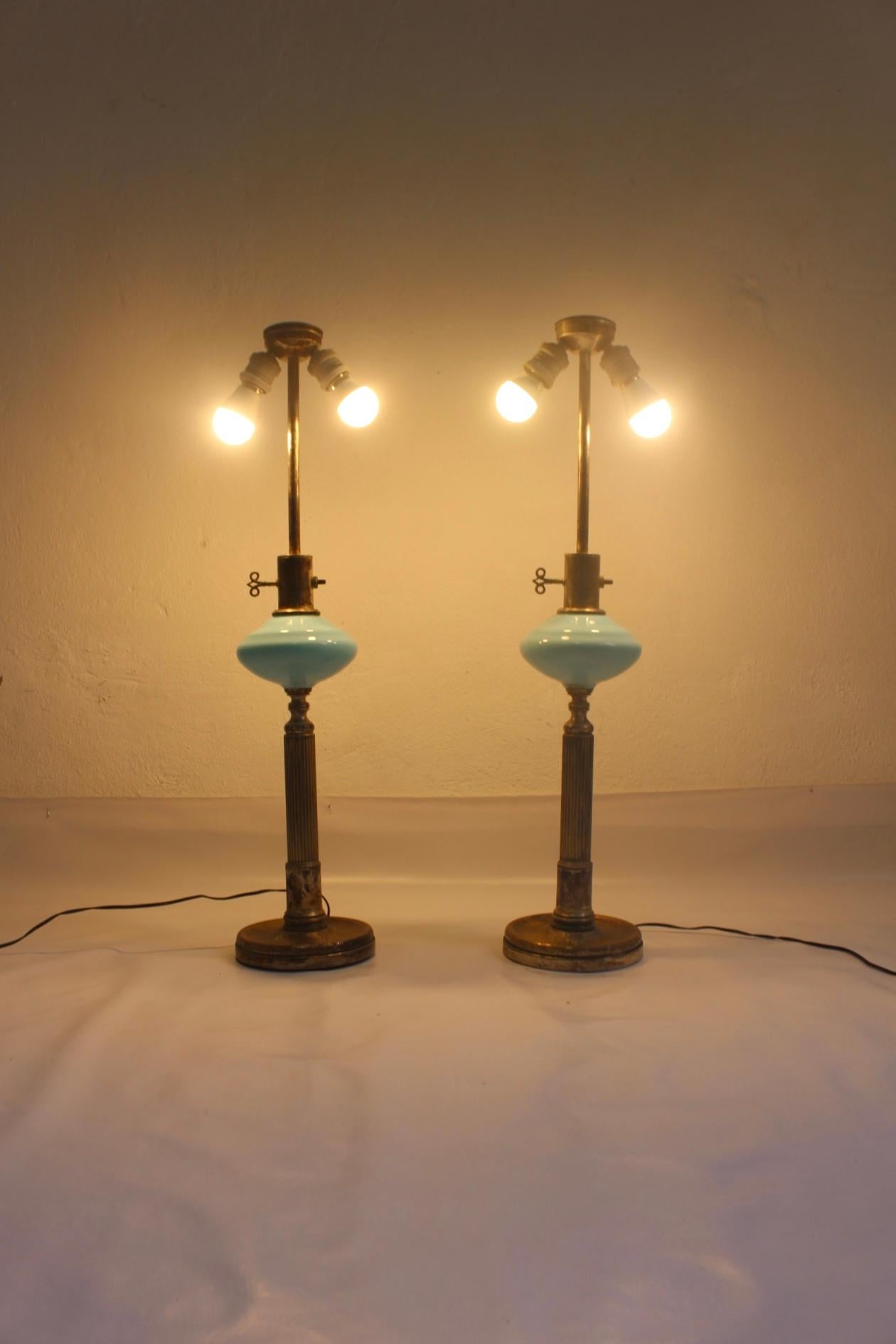 Set of two Art Deco blue opaline glass produced by Metalarte in the late 1930s or first 1940s. 
An early model from this Spanish lighting company, extremely rare to find.
Both pieces remaining in distressed condition but in perfect working