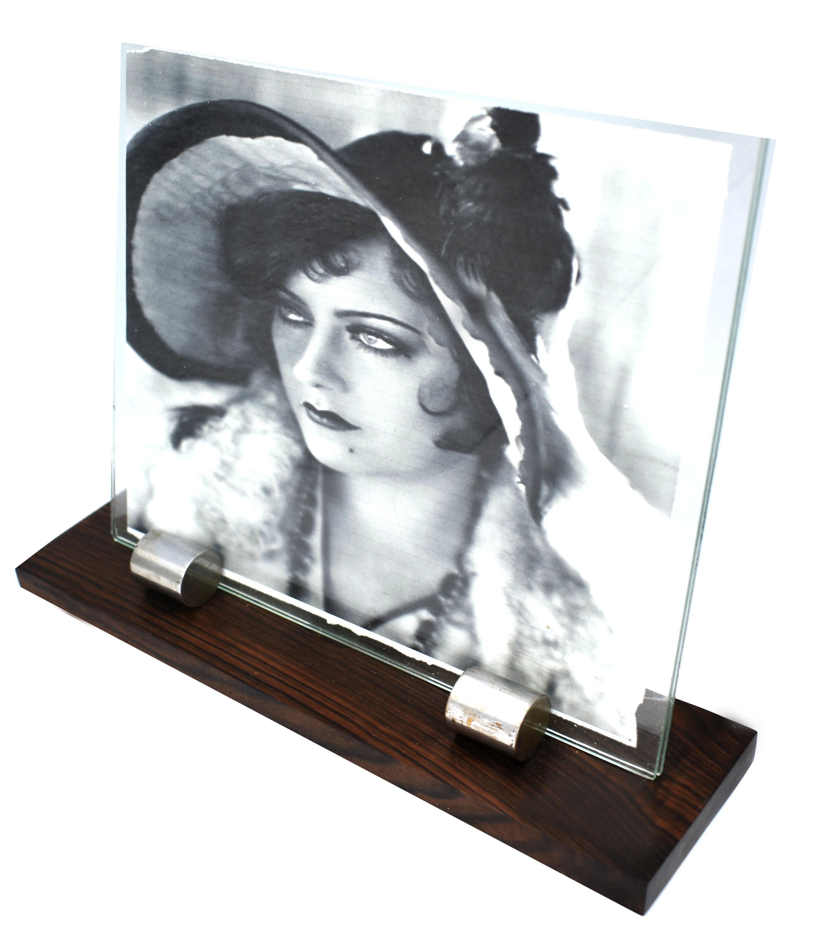 For your consideration is this large stylish 1930s Art Deco picture frame. Features a wooden base with two chrome accents which act as the glass holders. Lovely stylish piece, sourced in France and dating to the 1930s. The photo image inside the