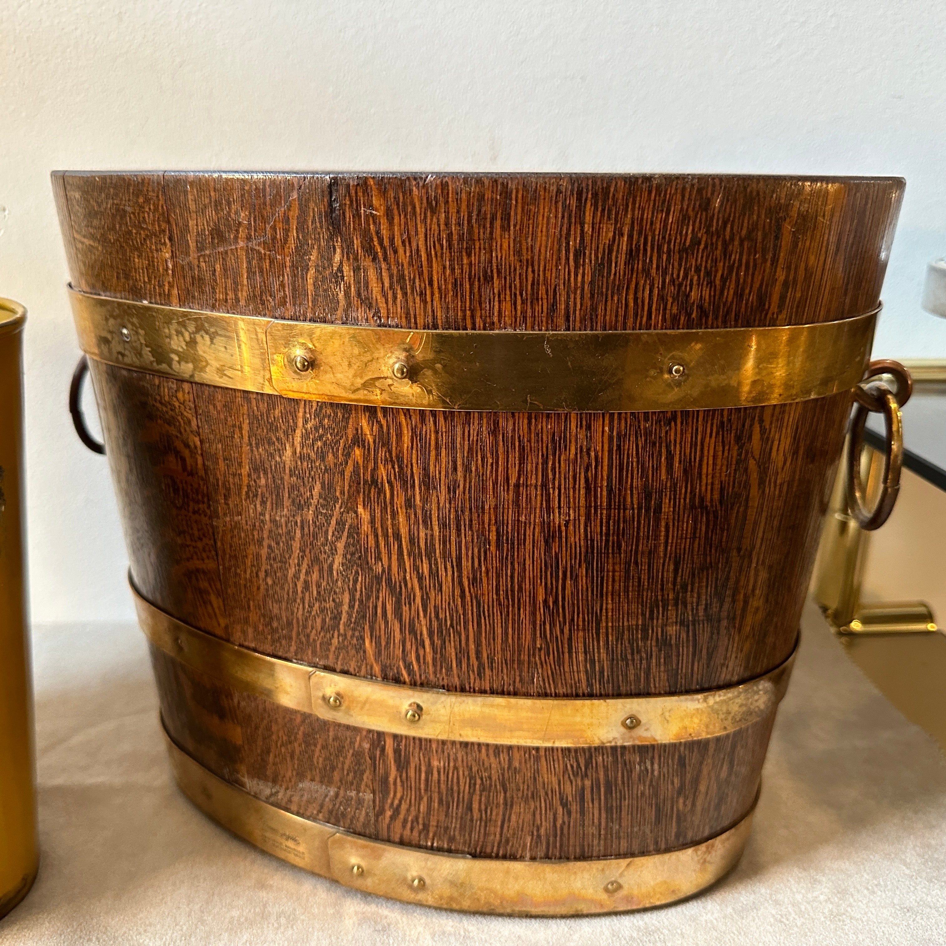 A superb oak and brass wine cooler designed and manufactured in France in the Thirties By Geraud Lafitte. It's in original condition and patina, marked on a side Geraud Lafitte meilleur ouvrier de France 1933. The wine cooler can be used for two