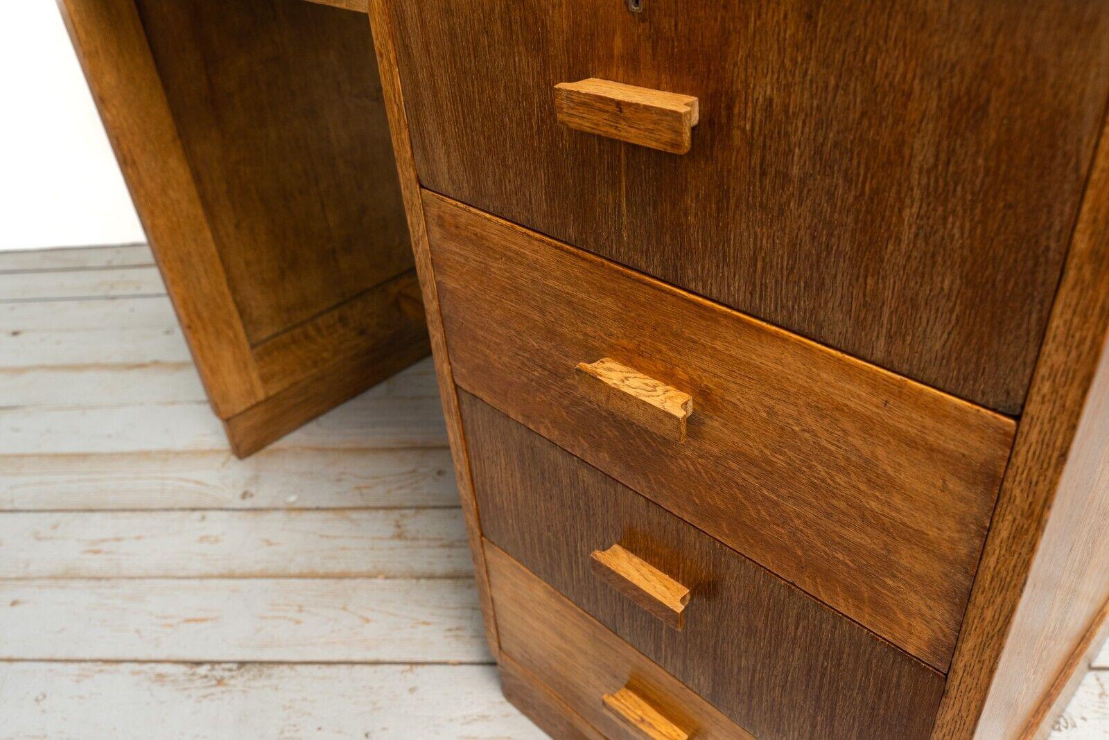 Heals desk 

1930s, Art Deco Oak Heals four drawer desk with blue leather top

Available to purchase is a Heals & Son Oak mixed tone four-drawer desk with Oak panelled sides and a blue leather inlaid top. The desk has superb provenance,