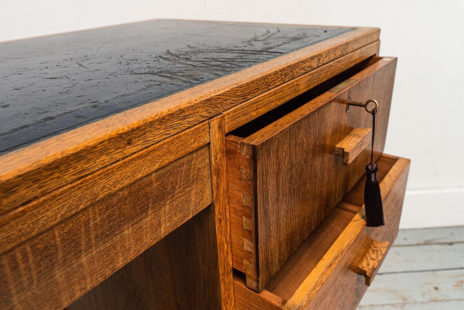 European 1930s Art Deco Oak Heals Four Drawer Desk with Leather Top For Sale
