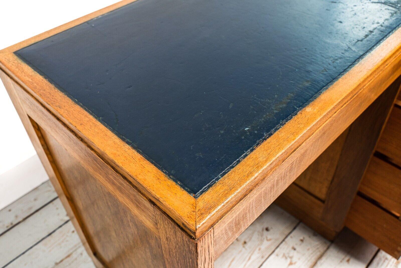 20th Century 1930s Art Deco Oak Heals Four Drawer Desk with Leather Top For Sale