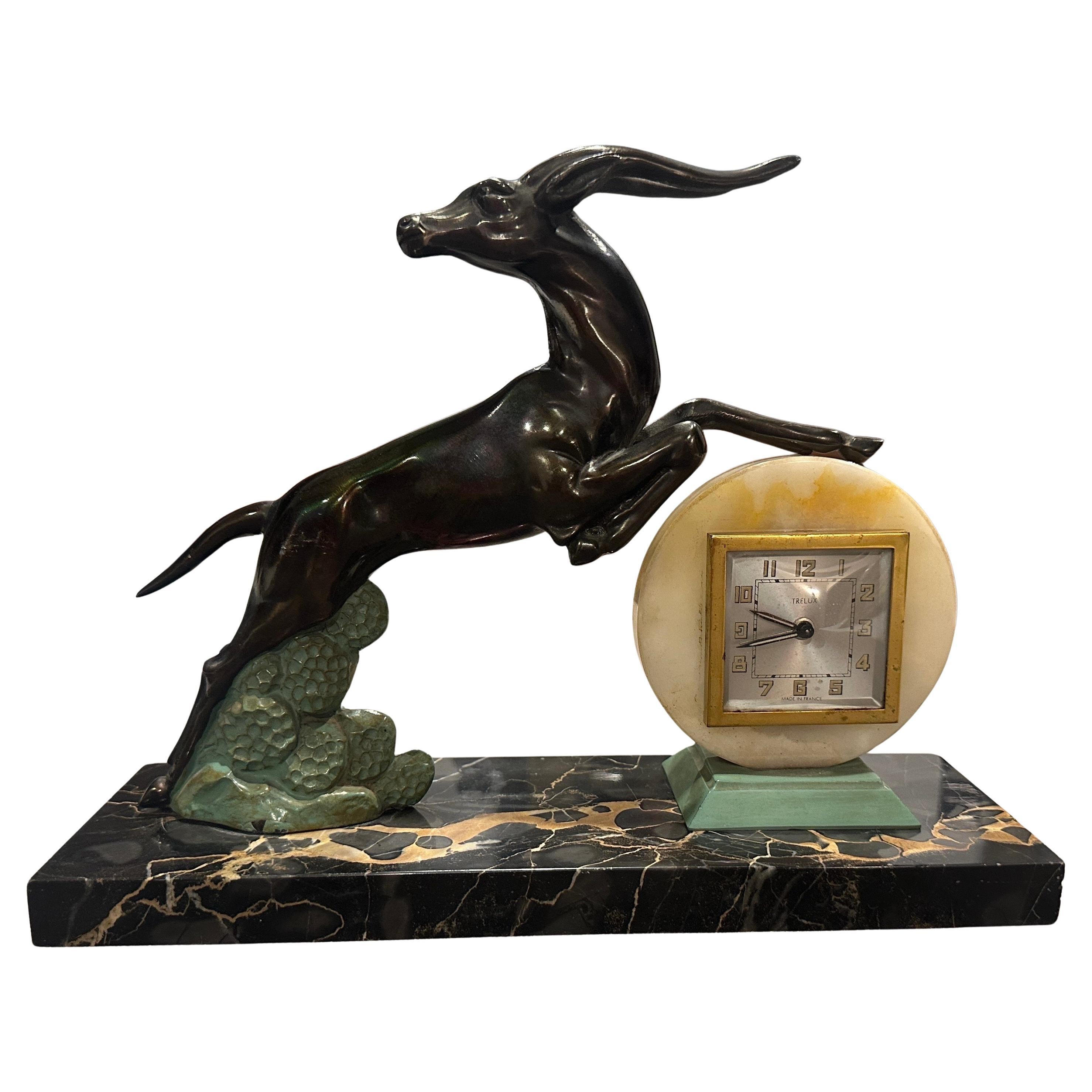 1930s  Reloj de sobremesa francés Art Déco Portoro de mármol y metal en venta