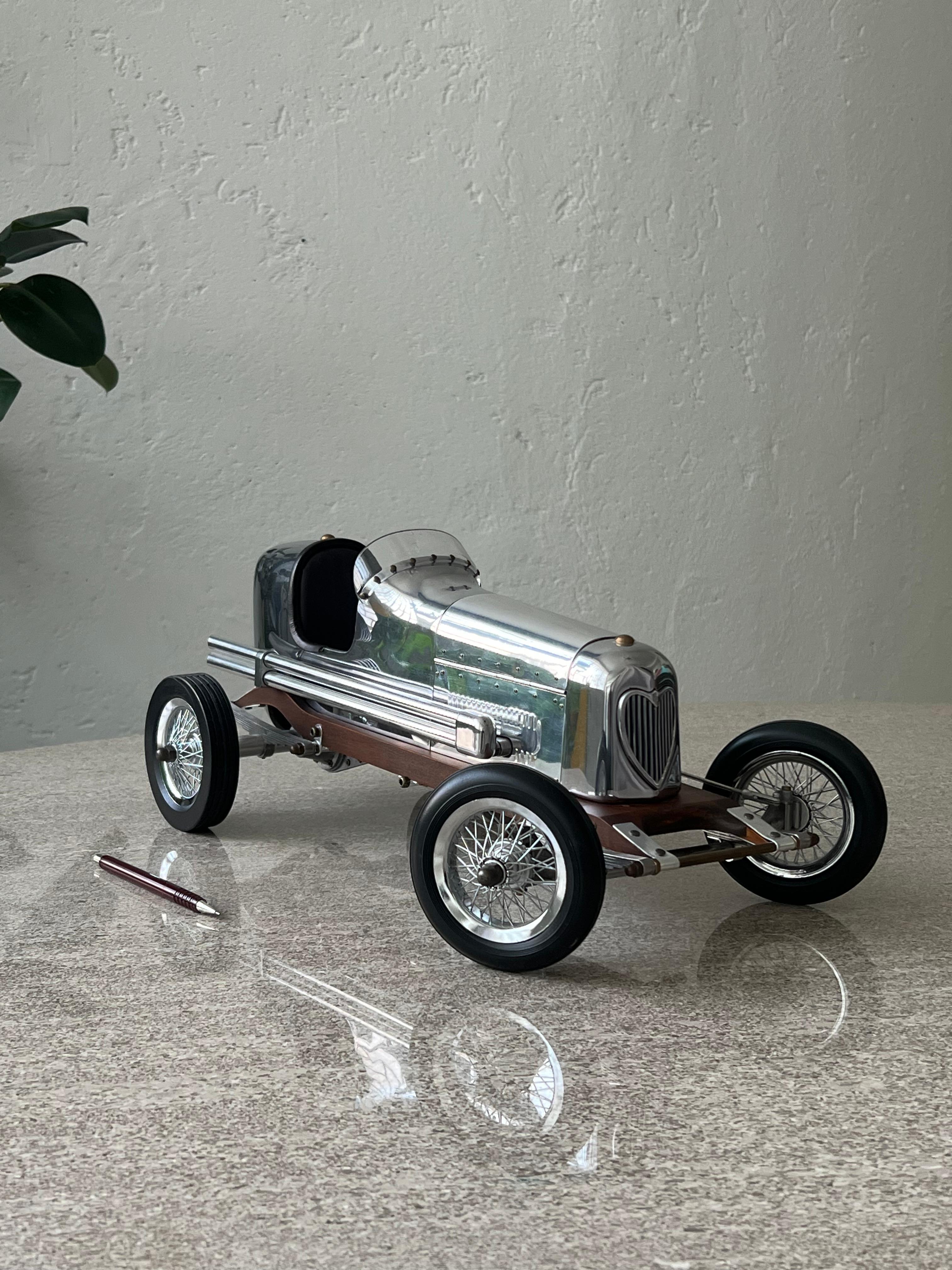 Decorative Model Car - Art Deco Race Car - Man Cave Collectible

A highly detailed, extremely attractive model of a classic racecar, replica of the miniature-engine scale models used for 