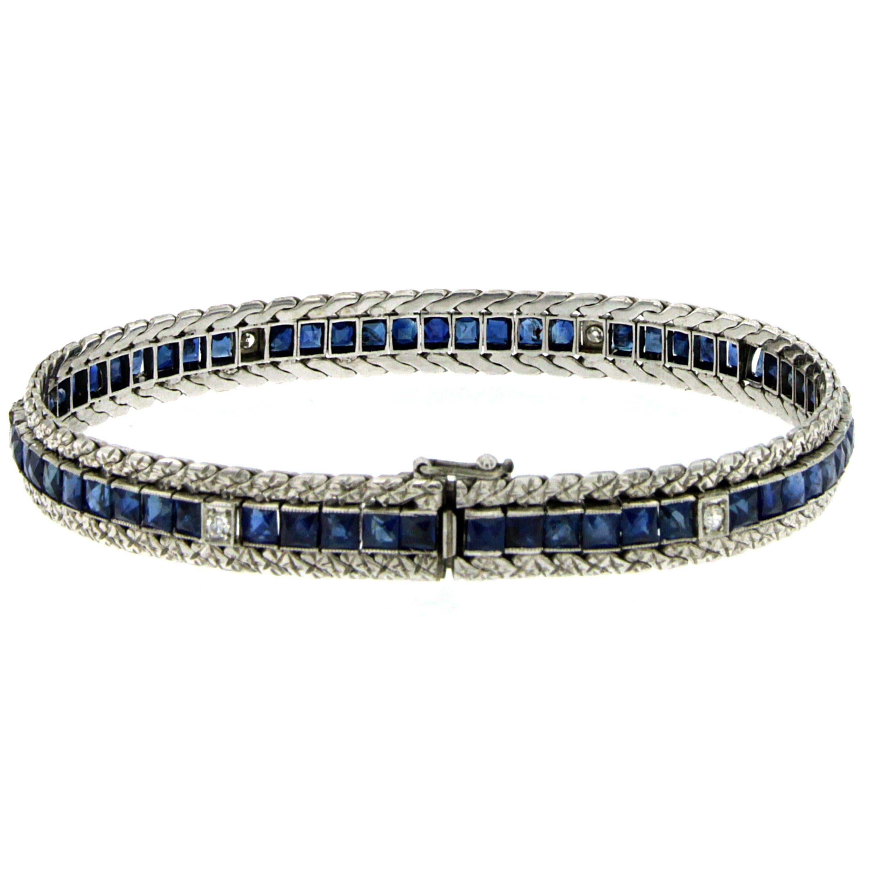 Platinum and White Gold Art Deco bracelet, set with sixty fine natural Blue Sapphire custom cut weighing 8,00 carats alternate with six sparkling Old European Cut Diamonds weighing 0,24 ct. graded I color, Vs clarity. 
It is engraved in typical Art