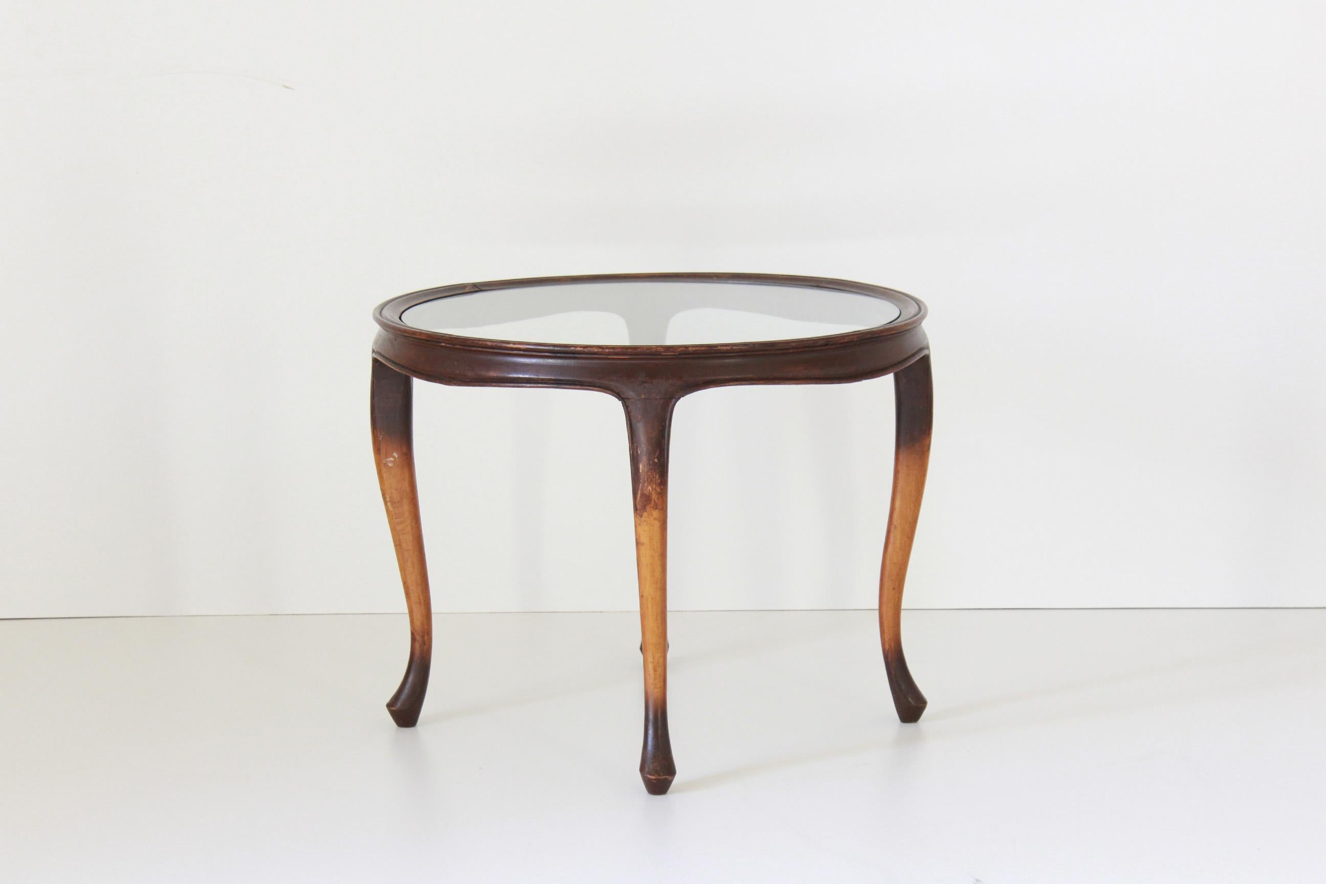 Art Deco Wood coffee Table, France 1930s.
An elegant 1930s Art Deco side table with glass top and solid wood curved wood structure. Wood has been restored and polished,
In very good conditions with only few signs of time.

 