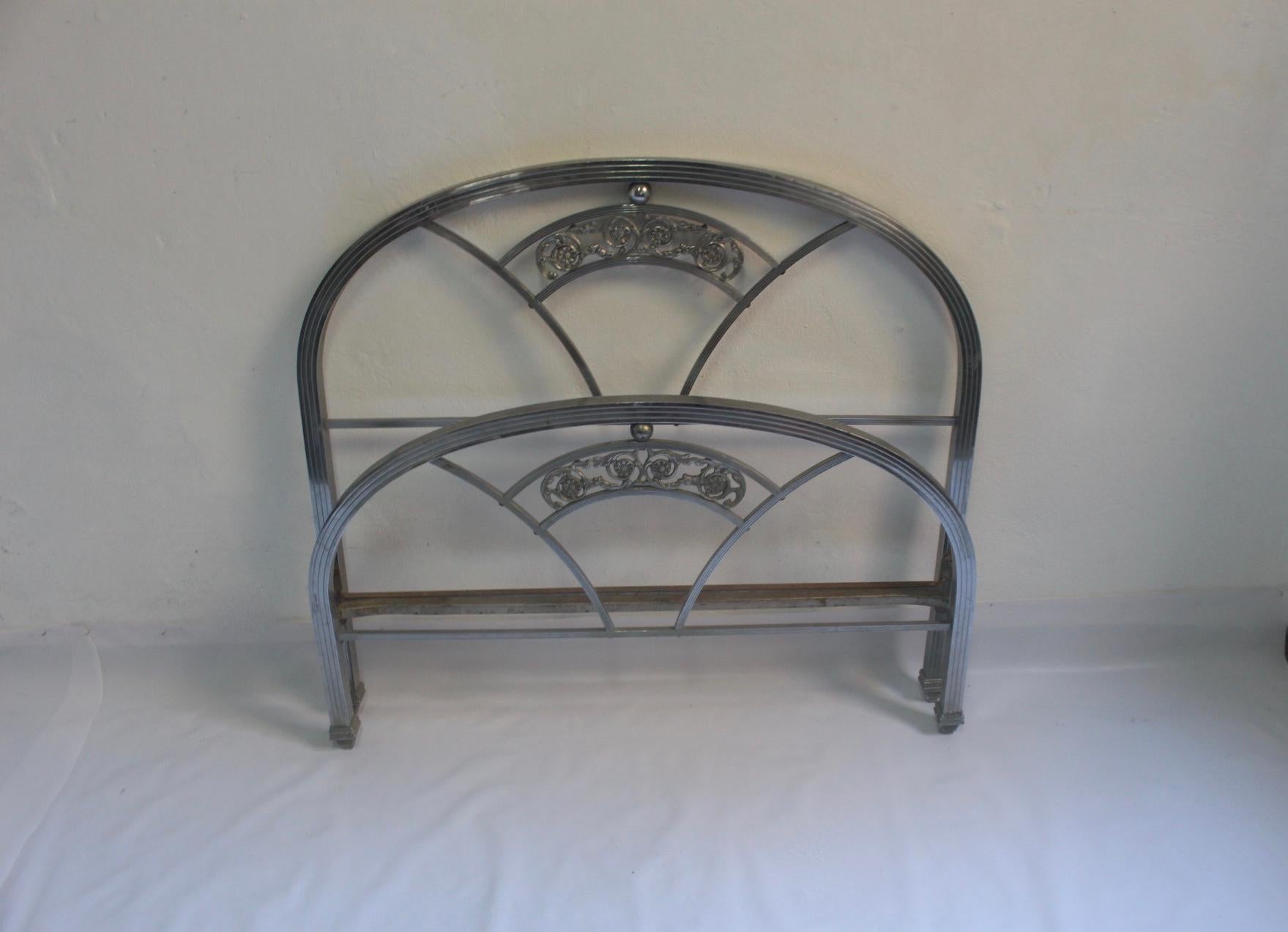 Art Deco nickeled brass bed, headboard and foot part, Spain, circa 1930s.
Fair condition. Note that both mattress support bars featuring oxide wear can be removed if need it. 
Nickeled brass structures featuring visible wear, but without oxide