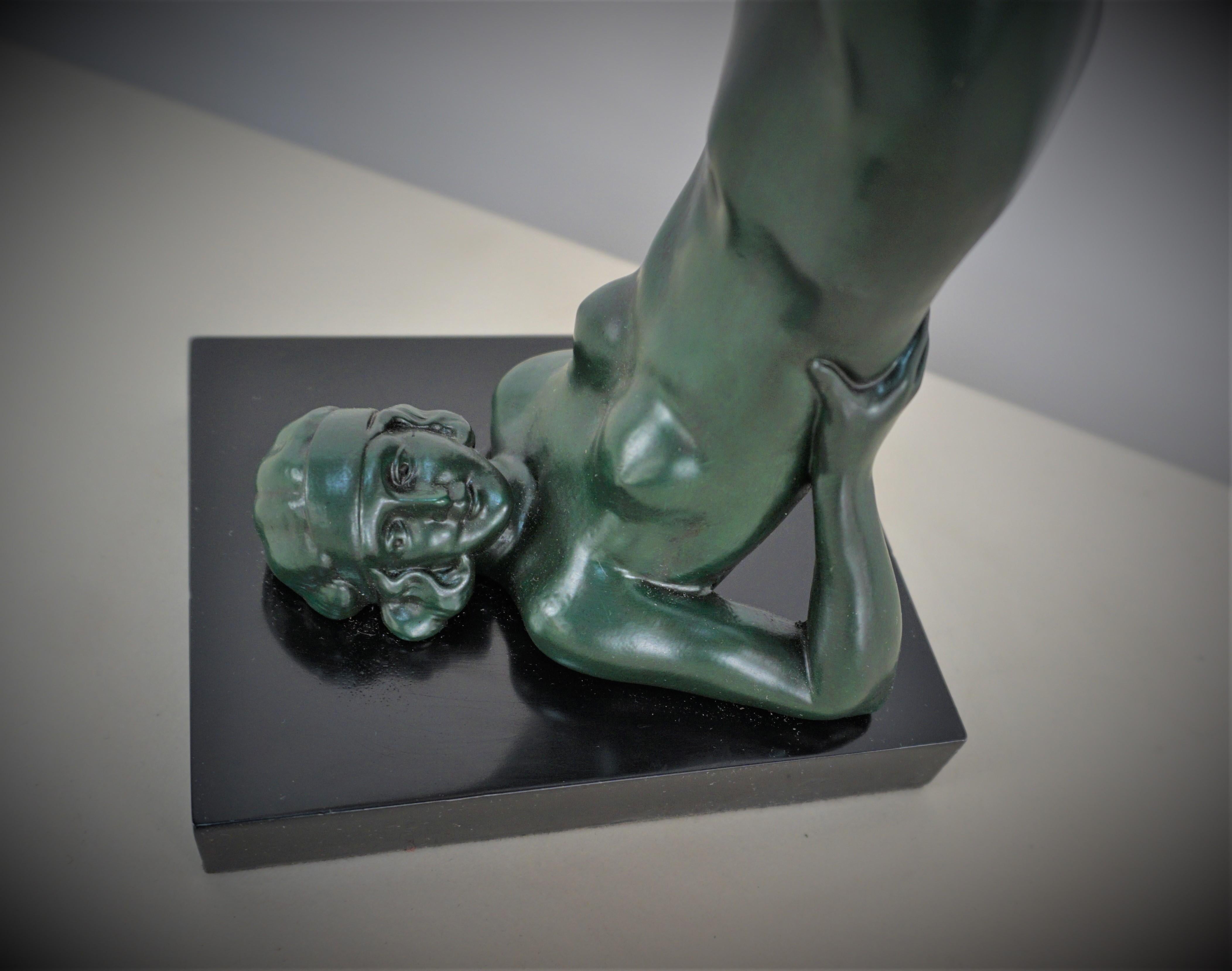 Beautiful 1930's art deco table lamp lady juggling ball on her feet.
Beautiful texture ball with lacquer finish sculpture.