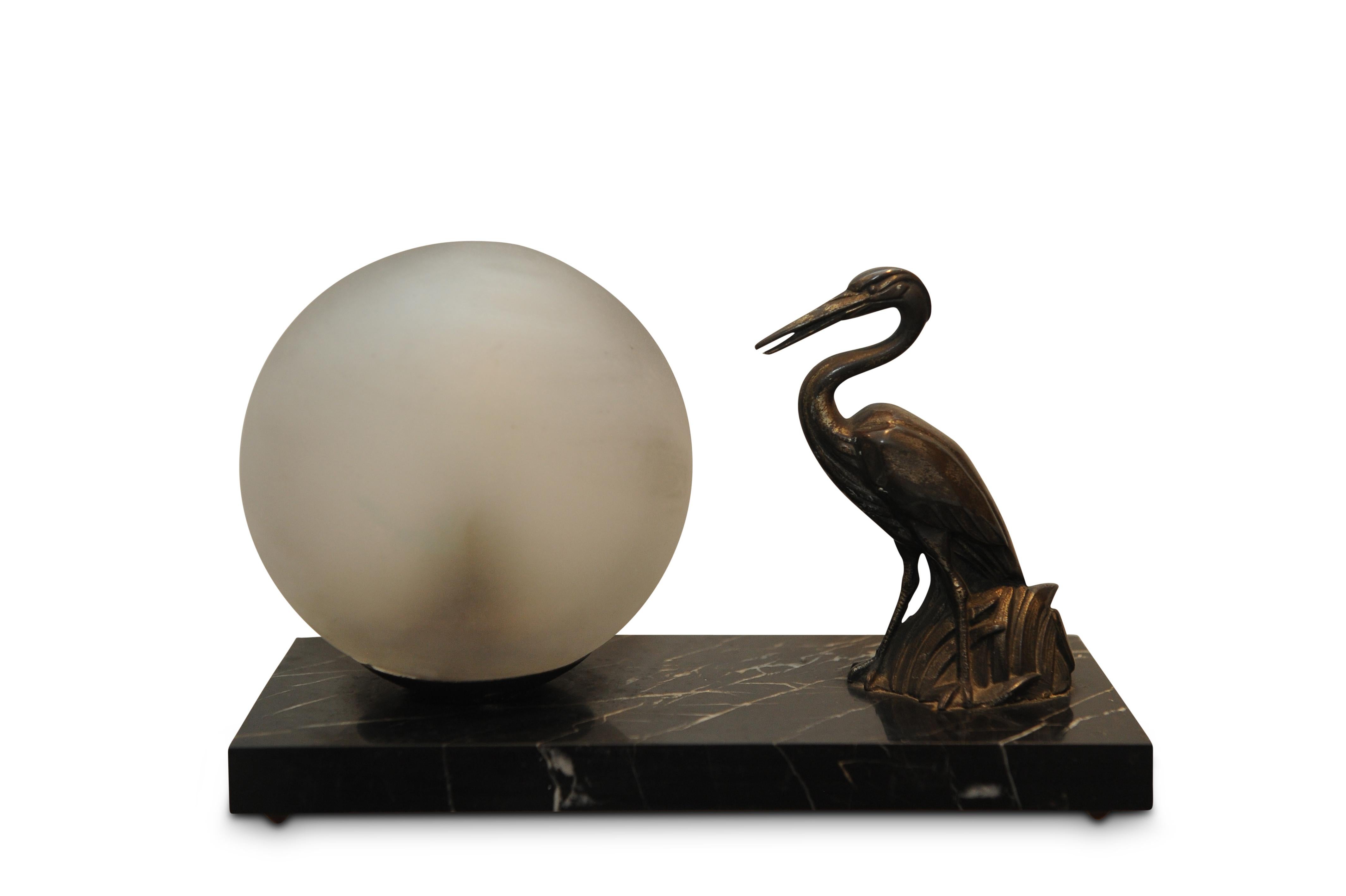 European 1930s Art Deco Table Lamp Spelter Sculpture of a Heron, a Glass Globe on Marble For Sale