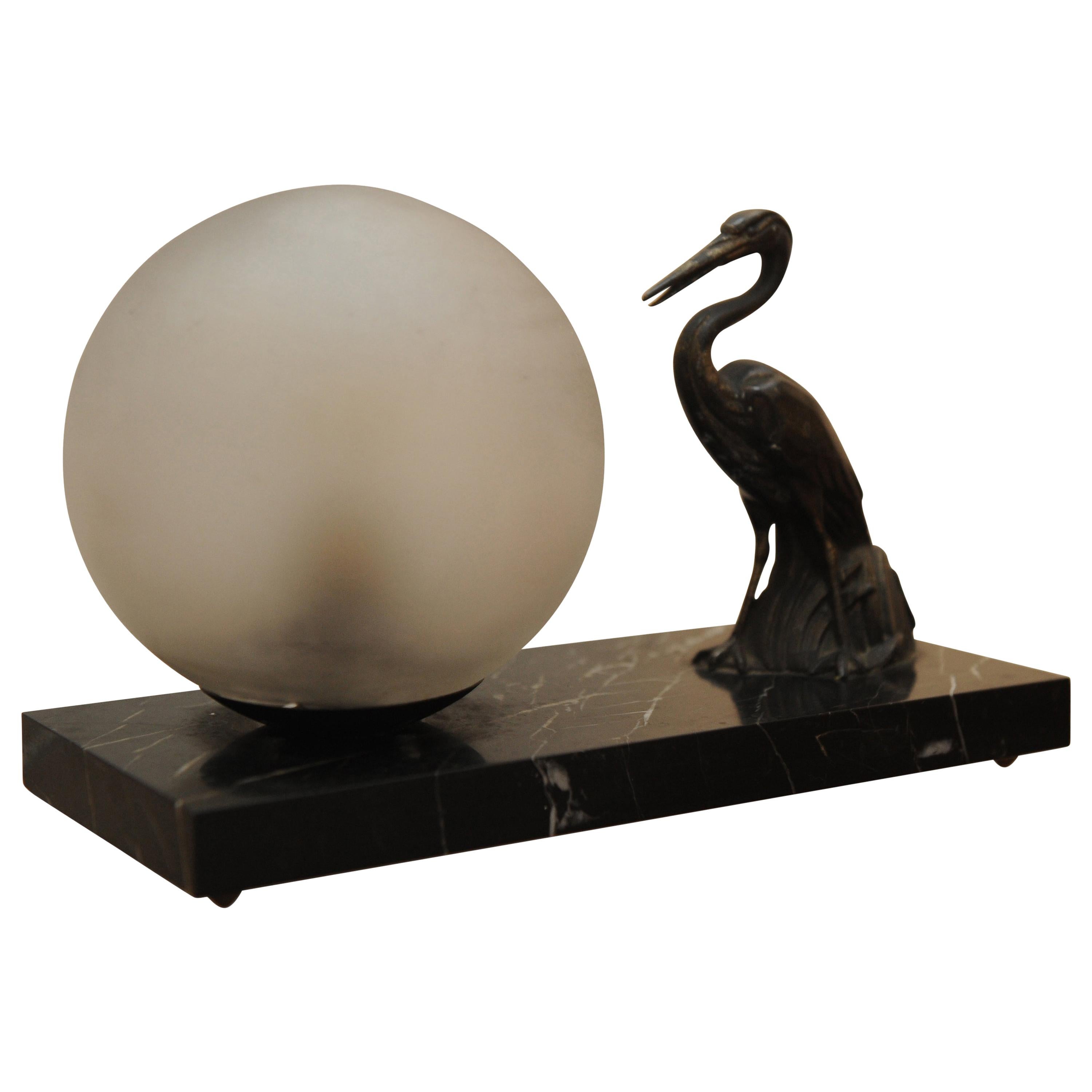1930s Art Deco Table Lamp Spelter Sculpture of a Heron, a Glass Globe on Marble For Sale