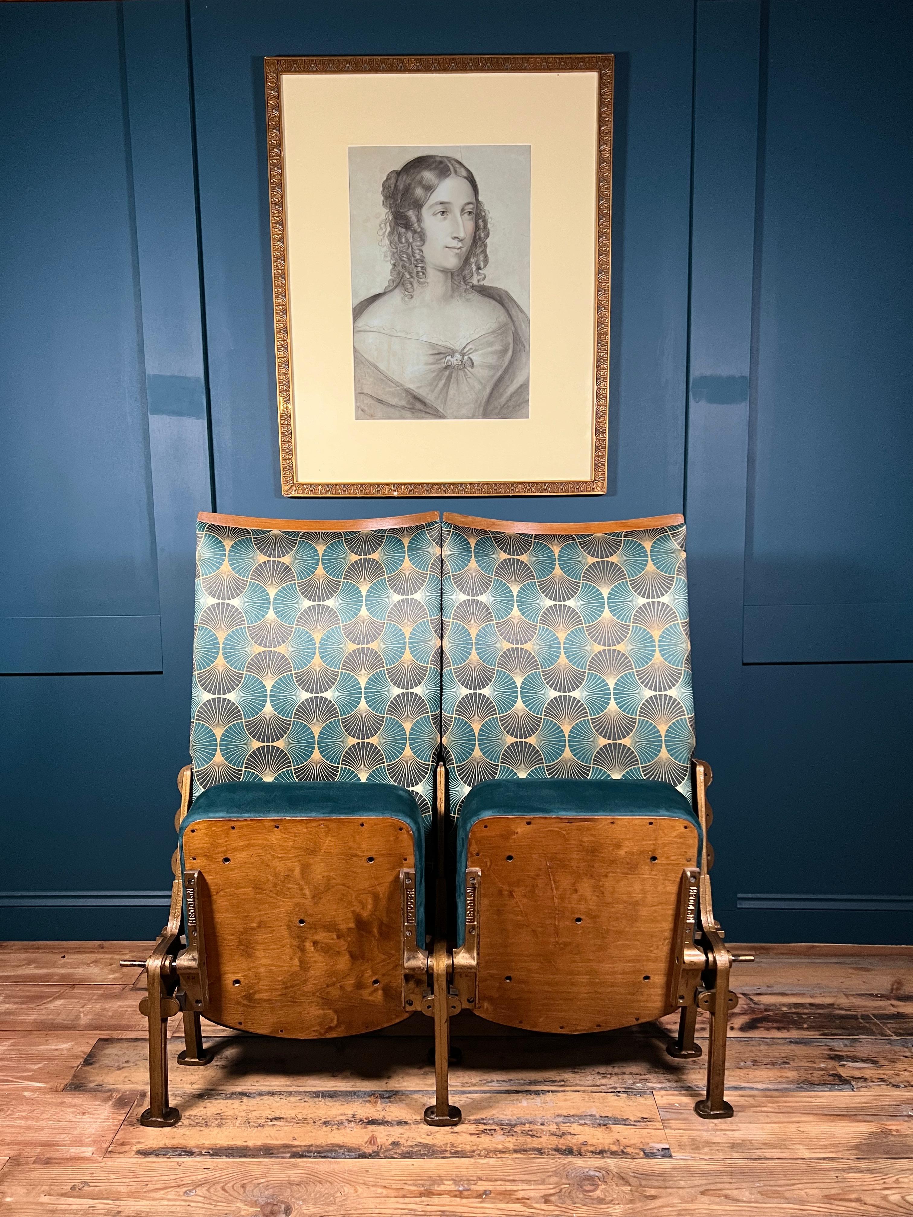 This stunning pair of 1930's Art Deco, Theatre/Cinema seats as a bank of two, will transport you back in time to the golden age of cinema. The seats have been professionally reupholstered in an Art Deco print fabric for the seat back and a luxurious
