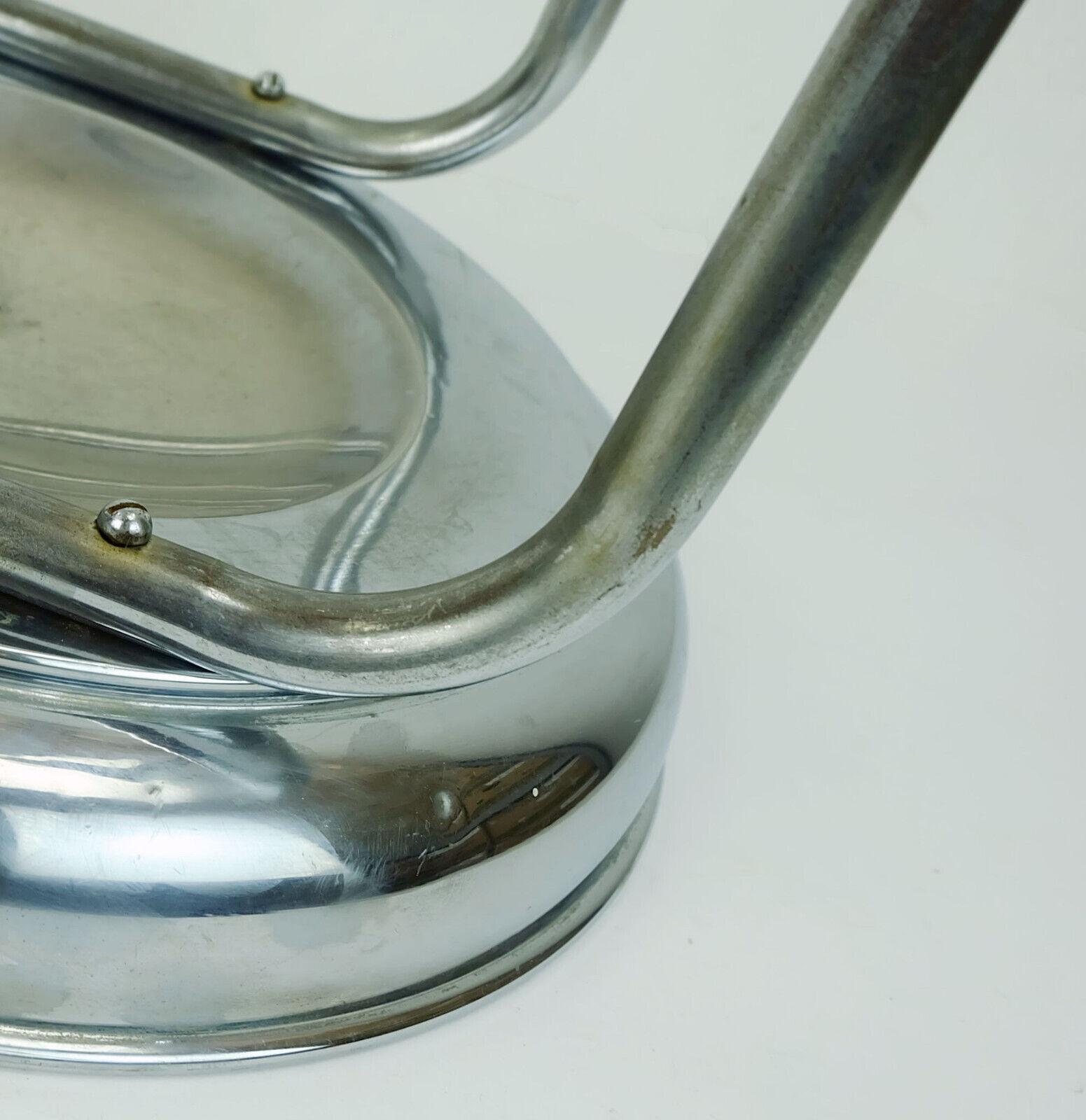 Umbrella stand from the 1930s. Origin Belgium or France. Made of chrome plated metal.

Dimensions in cm:
Height 49 cm, width 45 cm, diameter stand 31.5 cm.

Dimensions in inches:
Height 19.29