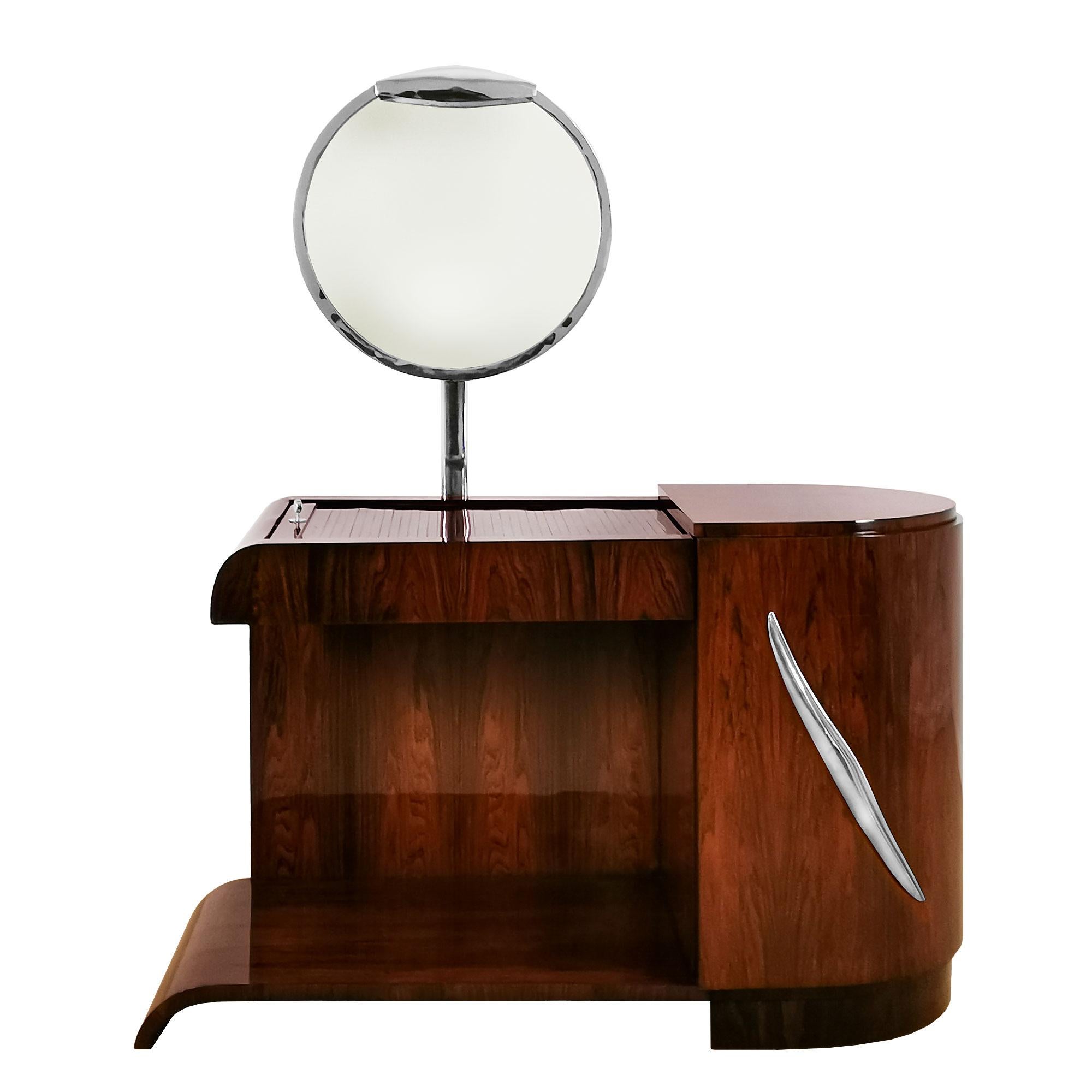 Exceptional Art Deco vanity, mahogany veneer with a sliding blind on top and a big door on the front, swiveling luminescent mirror and nickel plated brass handle, 4 sides completely finished.
France circa 1930.