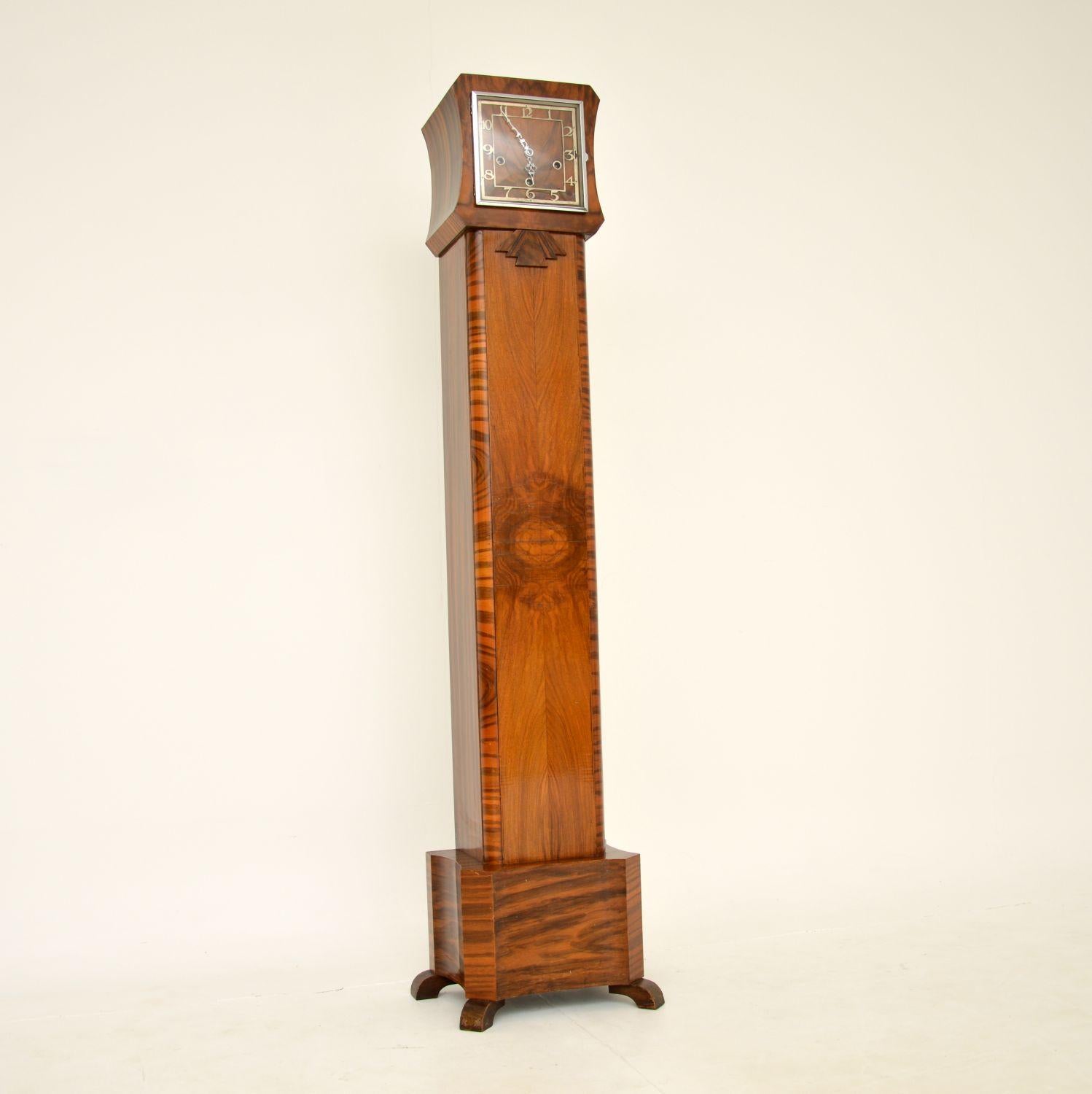 A fantastic original Art Deco period long case grandmother clock in walnut. This was made in England, it dates from the 1930’s.

It is beautifully designed, is of excellent quality and is a great size. The walnut colour tones and grain patterns