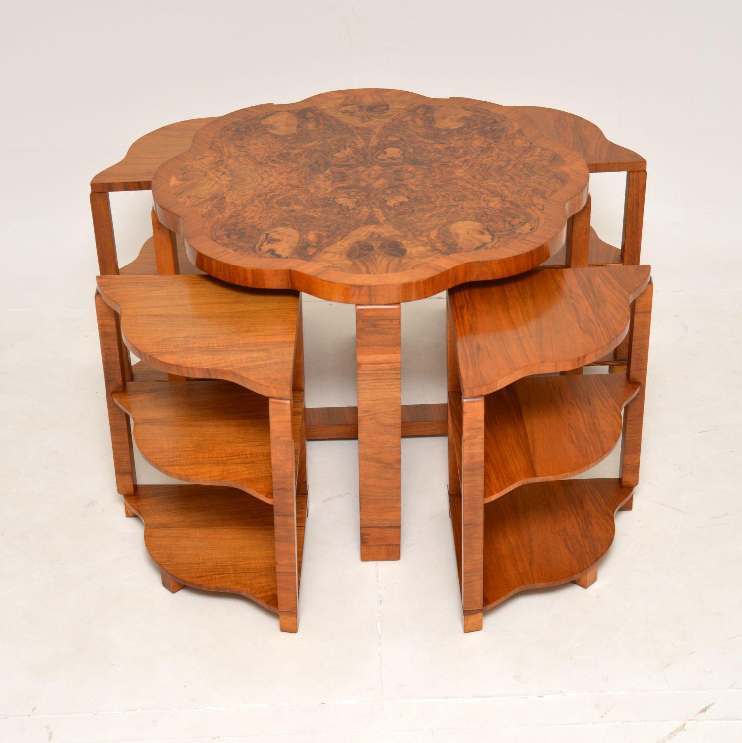 A fantastic art deco period nesting coffee table in walnut. This was made in England by Harry & Lou Epstein, it dates from the 1930’s.

This is of superb quality, with a beautiful flower shaped top and thick edges. It has a very useful design,