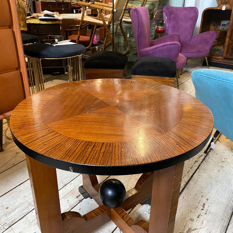 A stylish At Deco table in good conditions, various type of wood are in original patina, some parties are black painted.