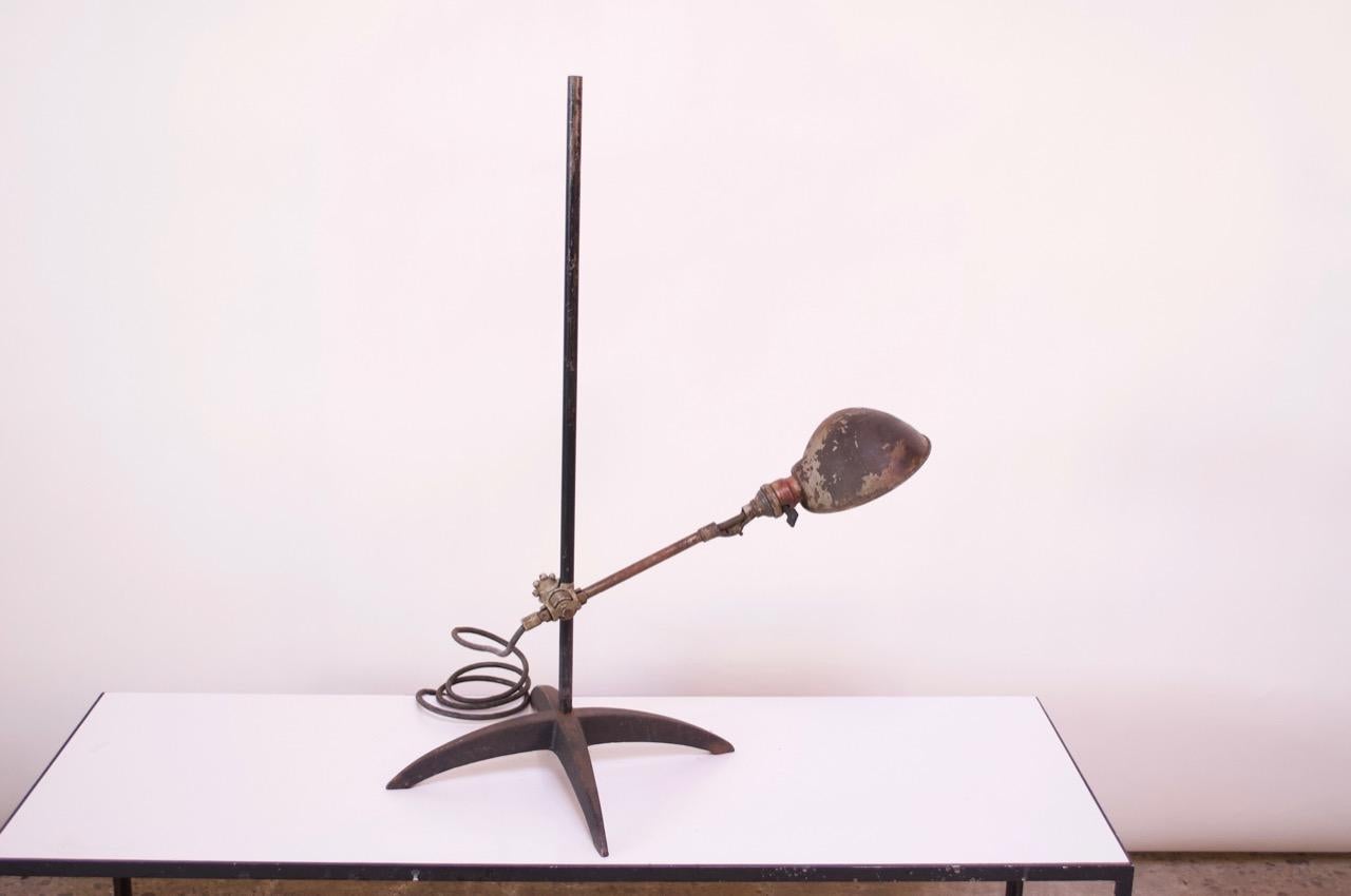 Task lamp designed by O.C. White (circa 1930s) composed of a steel arm, stem, and base with a painted shade. Unique size (height of the stem is 31.75