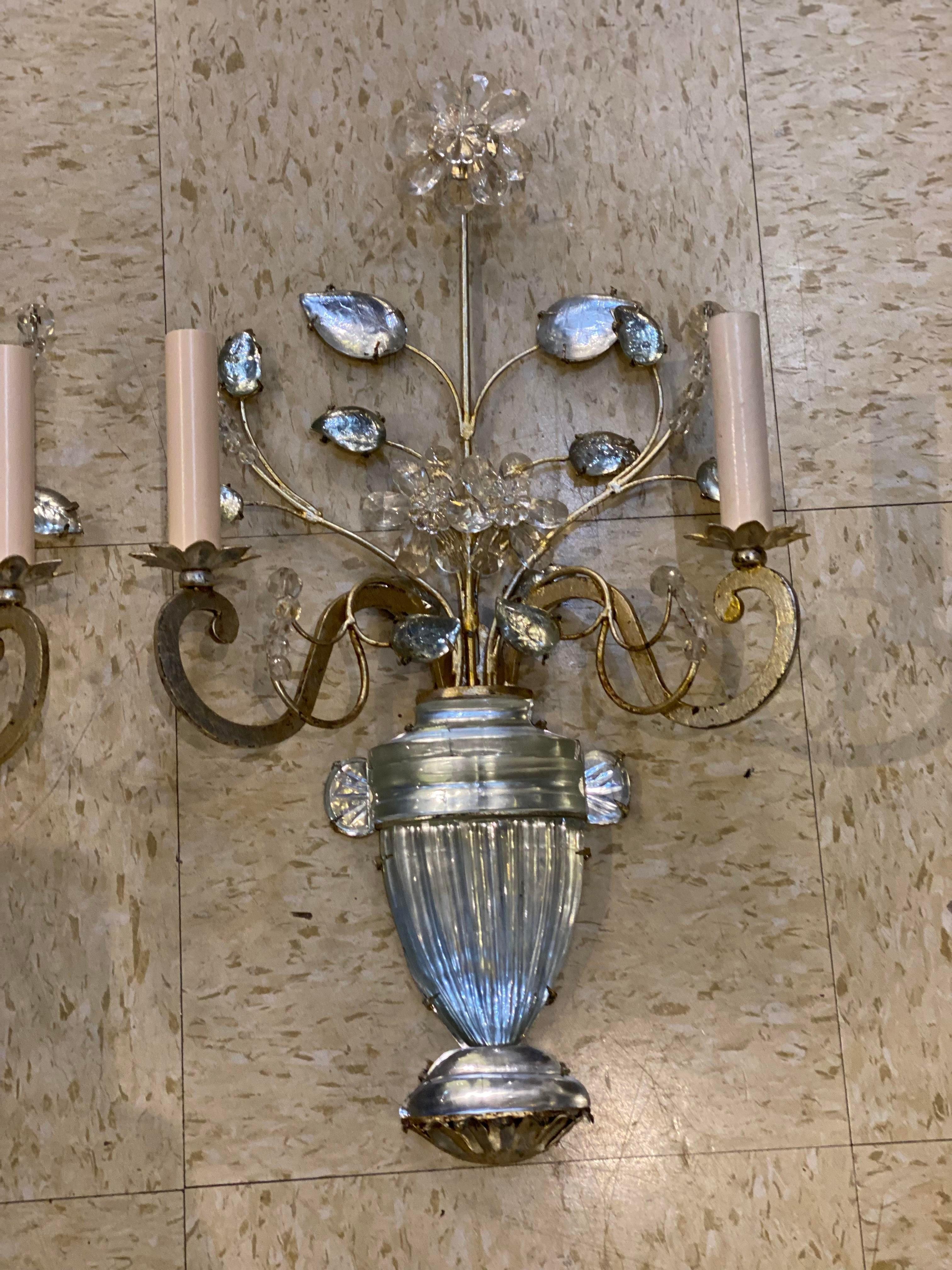 A pair of circa 1930’s silver leaf metal sconces with glass leaves and body 
