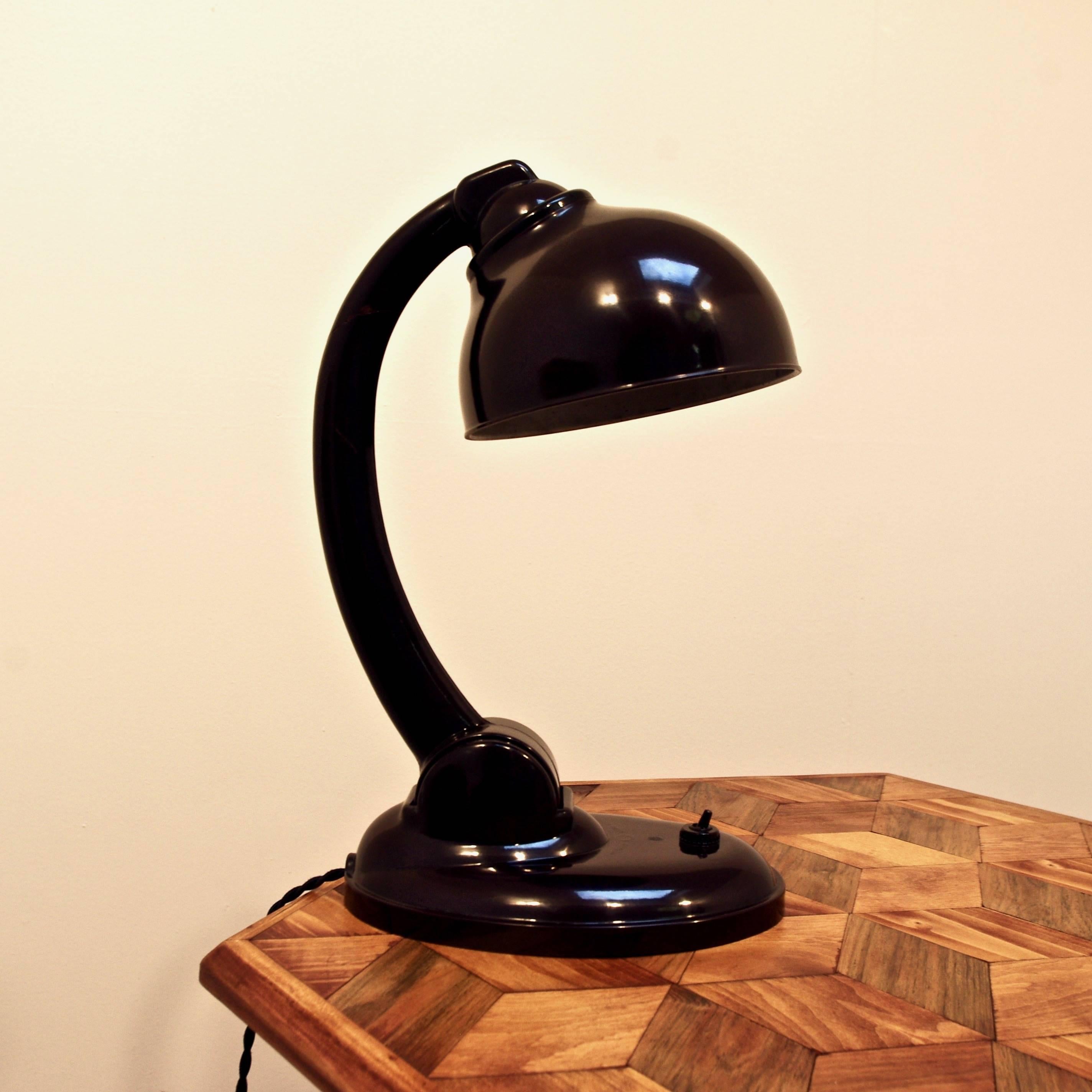 This bakelite lamp, model 11126, was designed by Eric Kirkham Cole and was produced by EKCO Ltd mainly in the 1930s. In the 1930s it was licensed to be produced in Czechoslovakia. It was a very popular model, especially because of the adjustability