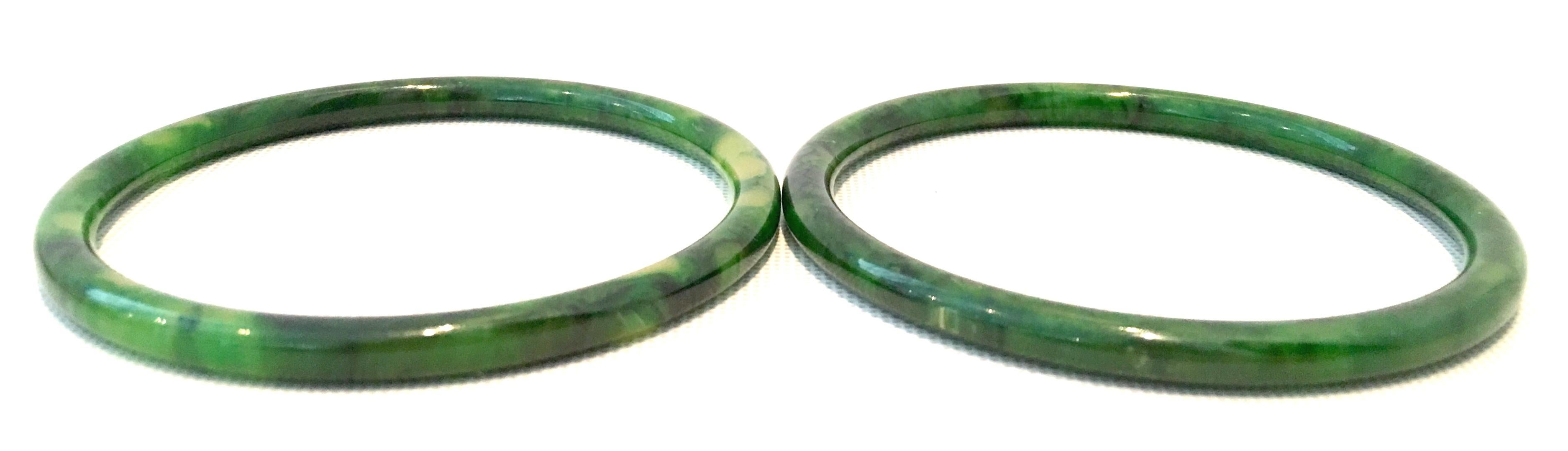 1930'S Bakelite Marbleized Green Bangle Bracelet and Earrings Set of Four Pieces. Set includes two bangle bracelets and one pair of earrings. Each bracelet is tubular and approximately, 3