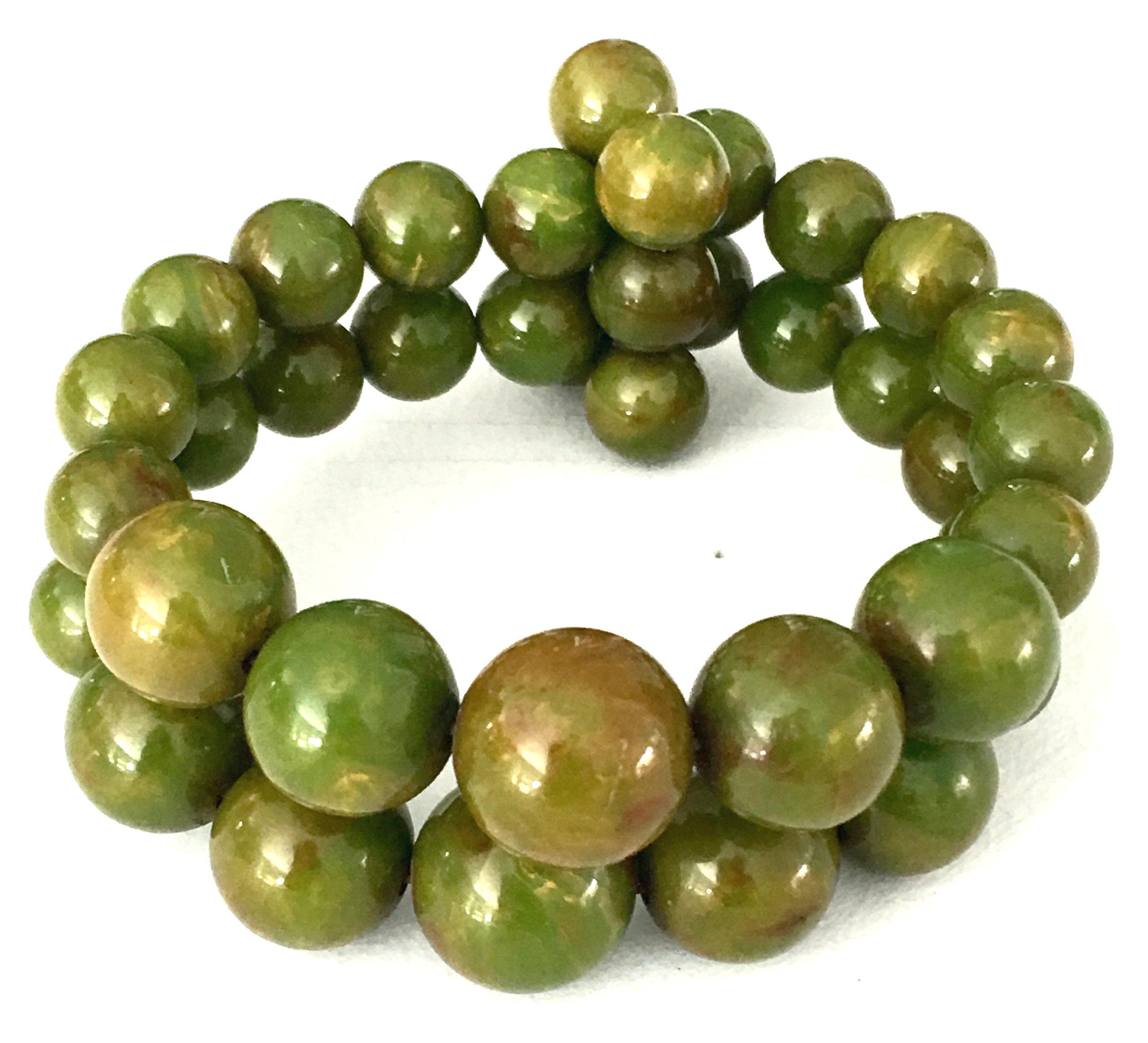 1930'S Bakelite graduated pea green round bead memory wire stretch bracelet. Two rows of graduating in size from 25